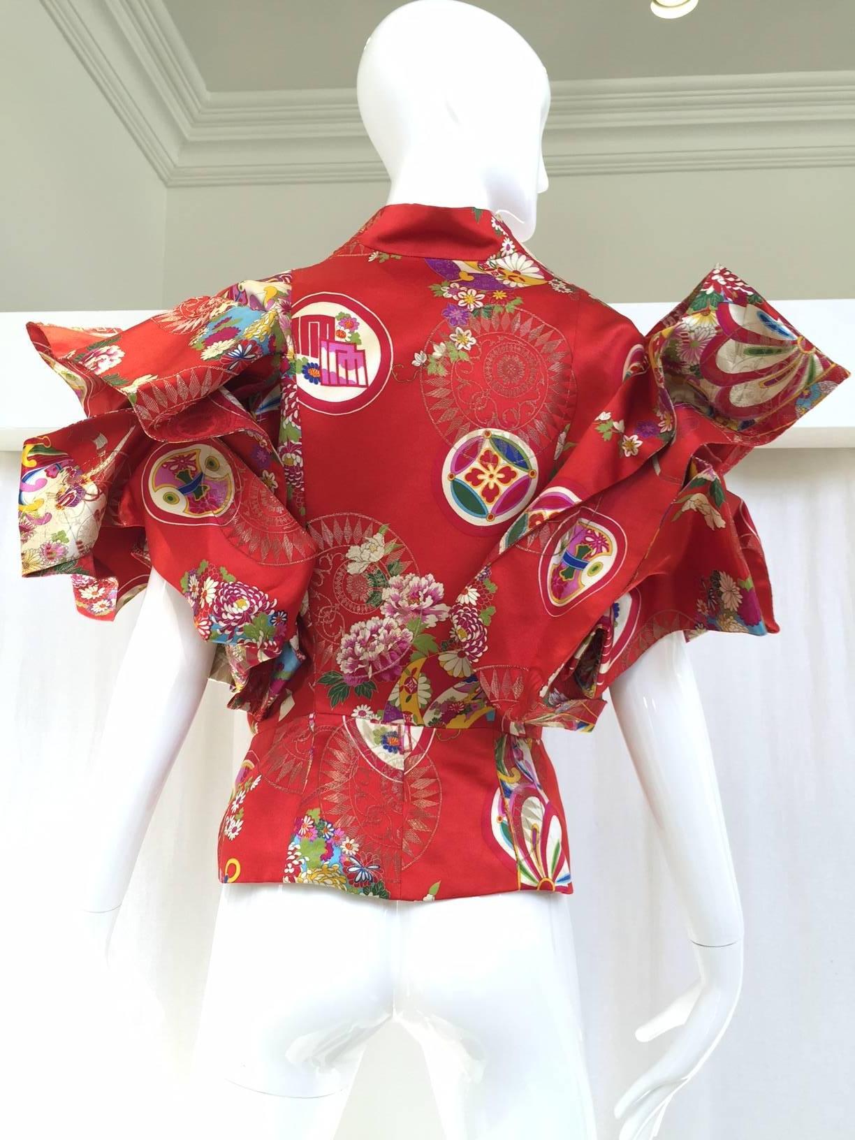 Rare Dramatic Christian Dior red chinese inspired silk brocade jacket designed by John Galliano. Dramatic sleeves. Jacket lined in silk. Must-have jacket for vintage collector or museum. 
Beautiful museum quality piece. In excellent condition! Size: