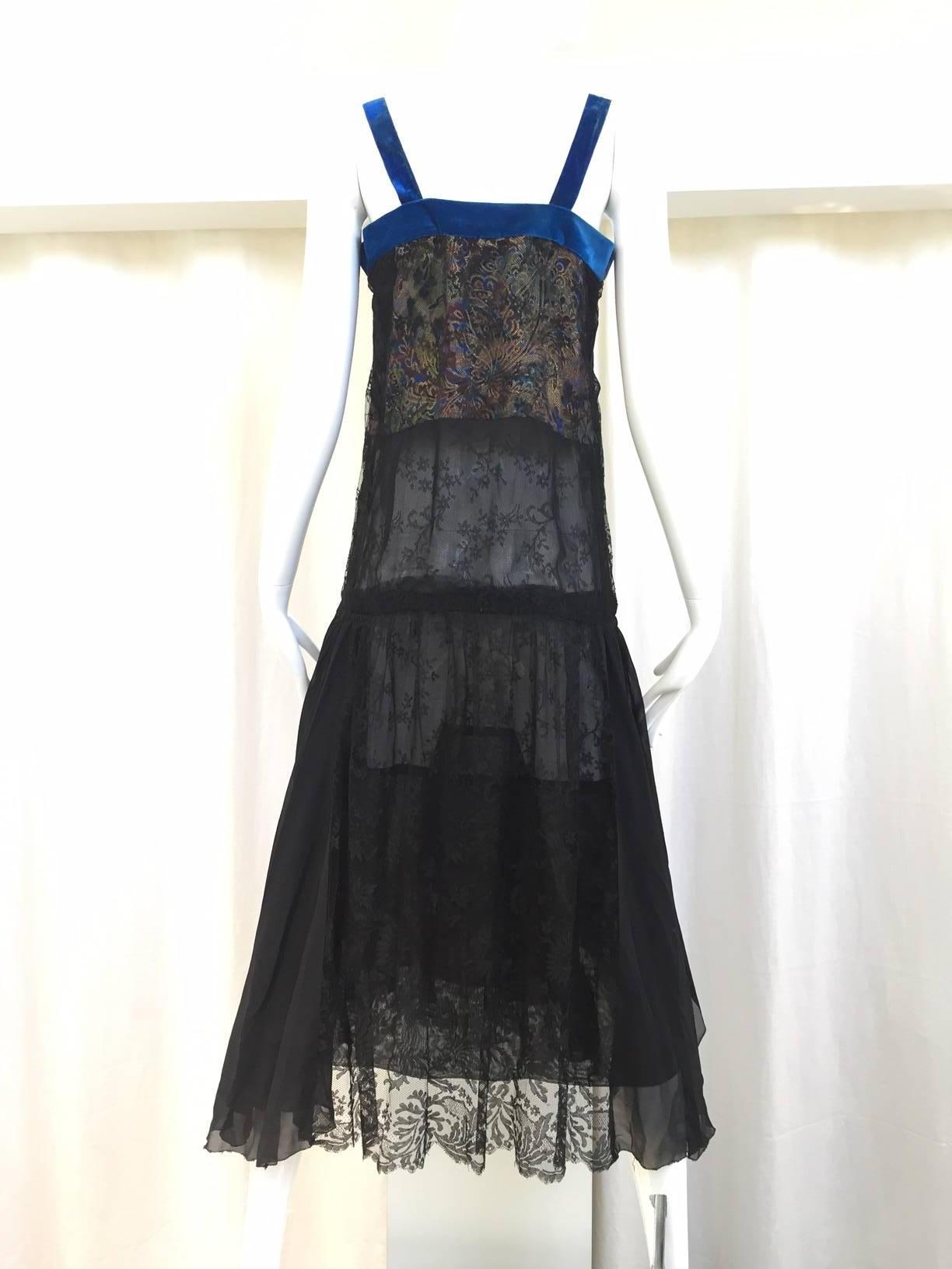 Beautiful Art deco 1920s black lace dress with metallic silk brocade inset and blue velvet strap. Perfect for Downtown abbey costume party .no zipper. Slip on dress. 
Bust: 34