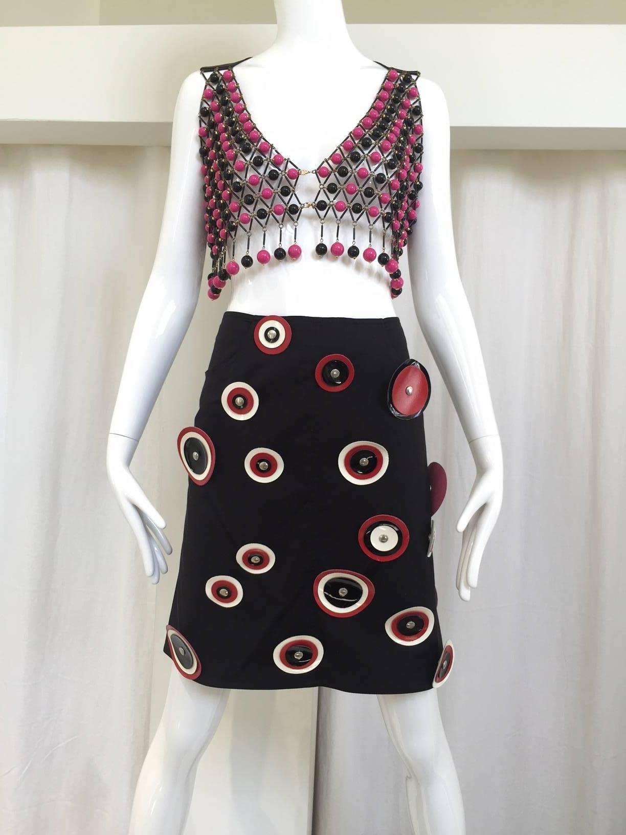 2000s Paco Rabanne black mini skirt with red, white and black vinyl leather cut out. Waist: 28