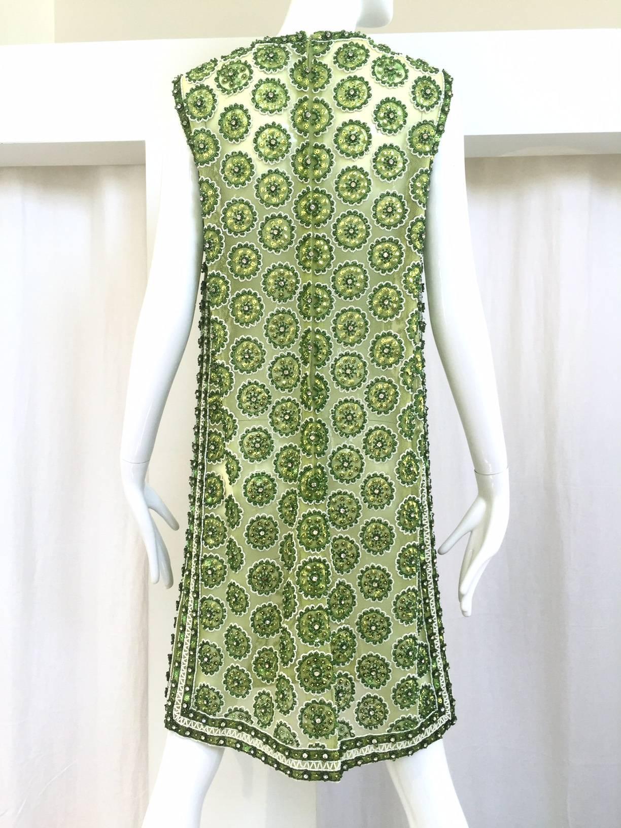 Beautiful 1960s lime green dress with beads and rhinestones. Size: 8
Bust: 36