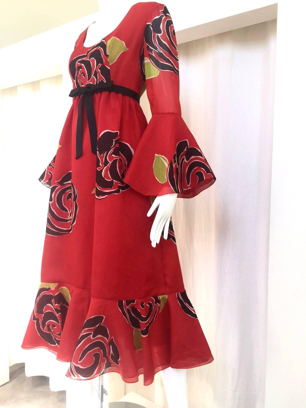 1970s SARMI red and black silk organza floral print maxi dress with satin bow. 3/4 sleeves.
Medium 
size: 6/ Bust: 36