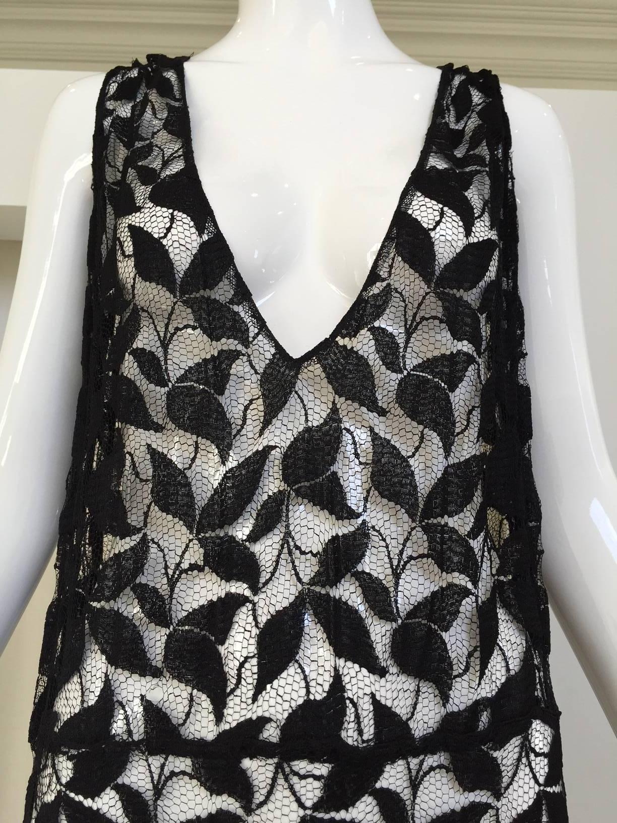 For Design purpose . some tears on both shoulders.  ( see pictures) overall this dress still wearable.
Beautiful 1930s silk lace with leaves cut out.  Size: 6/8
Bust: 40/ Waist: 38"/ hip: 40"/ Length: 59"