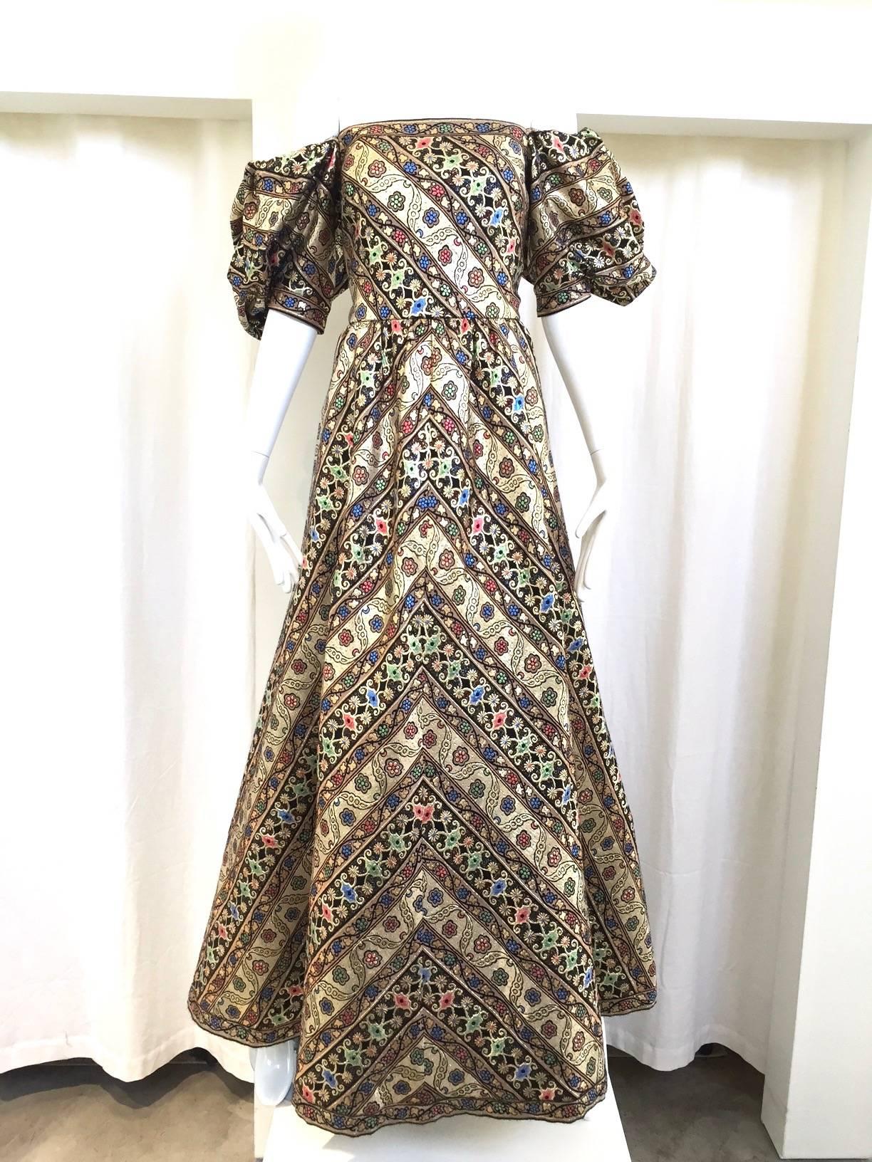 Beautiful 1980s Vintage Leonard Paris floral metallic silk brocade gown with dramatic sleeve. Vibrant gold, blue, pink and green rich metallic color. Dress can be worn off shoulder. This dress is in excellent condition ( barely worn) and perfect for