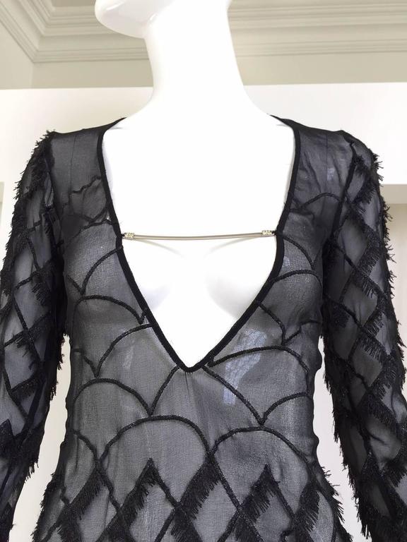 Sexy 1990s Versus Versace black silk sheer dress with eyelash fringe sheath dress.
Bust: 32