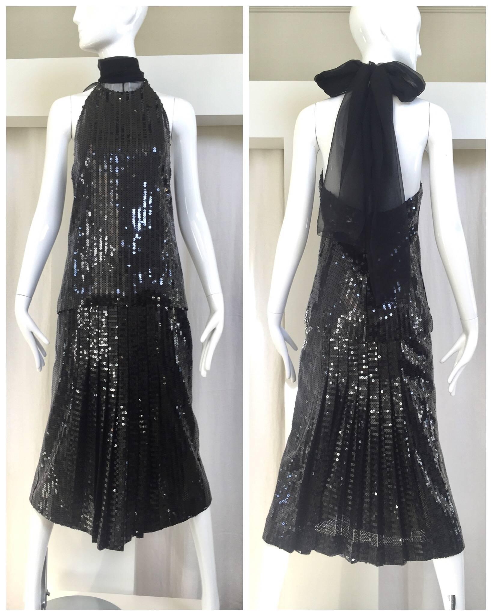 Chic vintage Christian Dior designed by Gianfranco Ferre halter sequin top and pleated skirt set. Top has silk chiffon sash that you can tie it as a bow.
 Size 4. Top fit size 4 Small
Skirt waist: 23