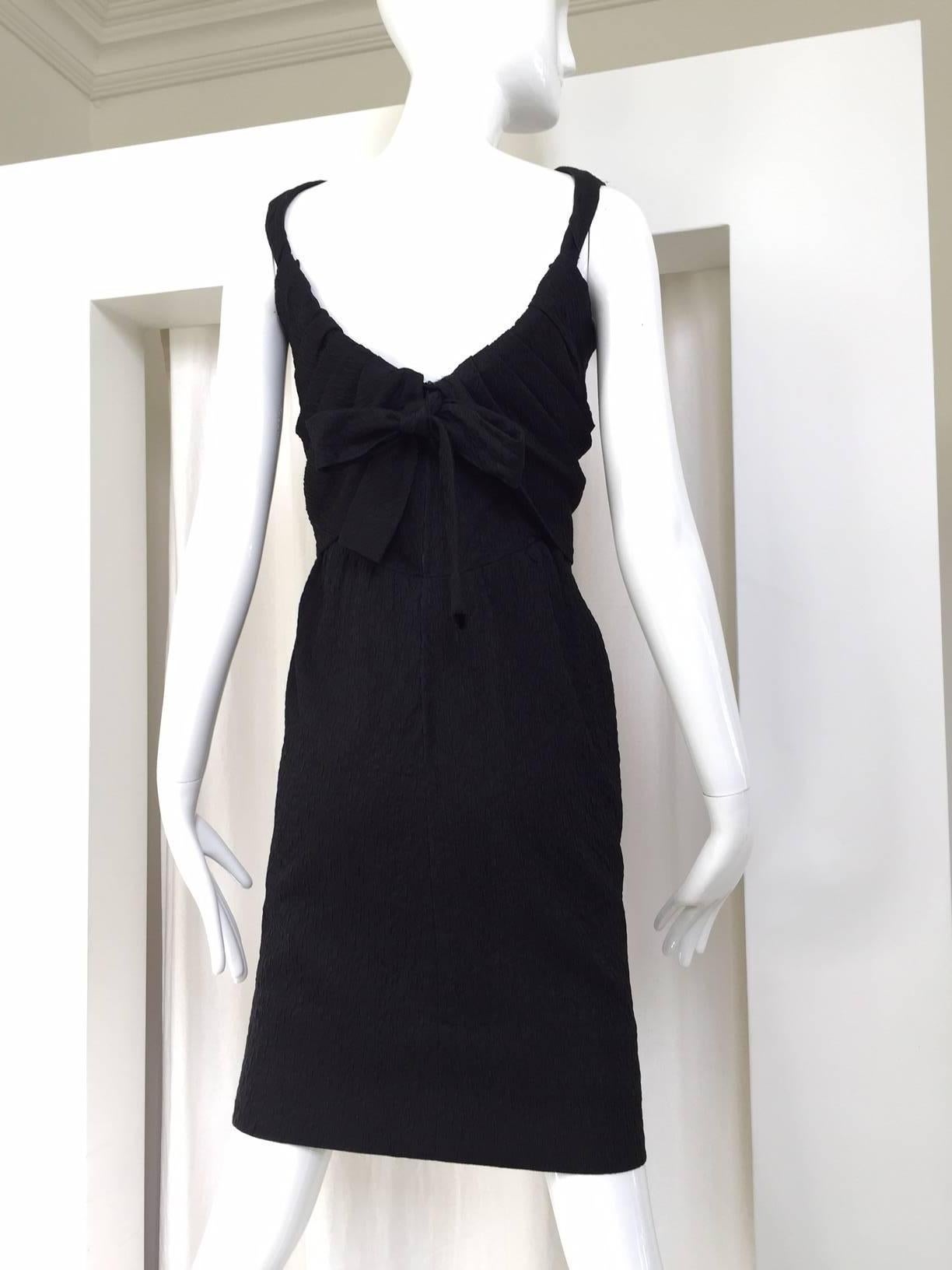 This Timeless Little black dress 1960s Givenchy haute couture silk matelassé is a Classic Audrey Hepburn style dress. This dress remind me of the movies Paris when it sizzles !
A similar version of this dress in chartruese color can be found in The