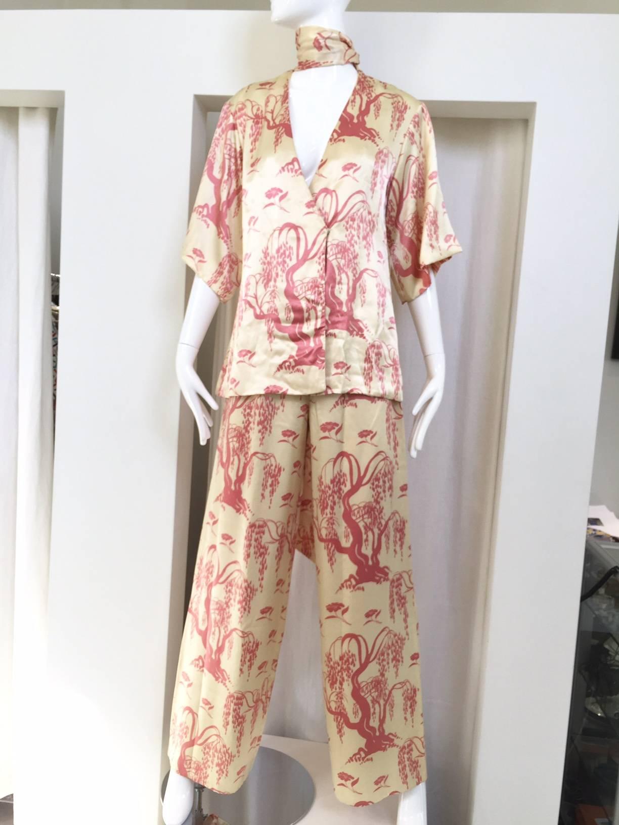 Chic and fun 70s Creme and pink salmon satin charmeuse kimono style top and pant set with sash.  Top fit size 4/6
Pant waist measurement: 26"