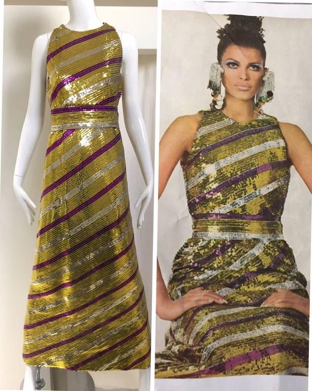 What a fun party dress. See editorial pictures from 1960s Vogue Magazine editorial. 1960s metallic Yellow, purple and silver stripe iridescent sequin sheath cocktail maxi dress with belt. 
Bust:  34