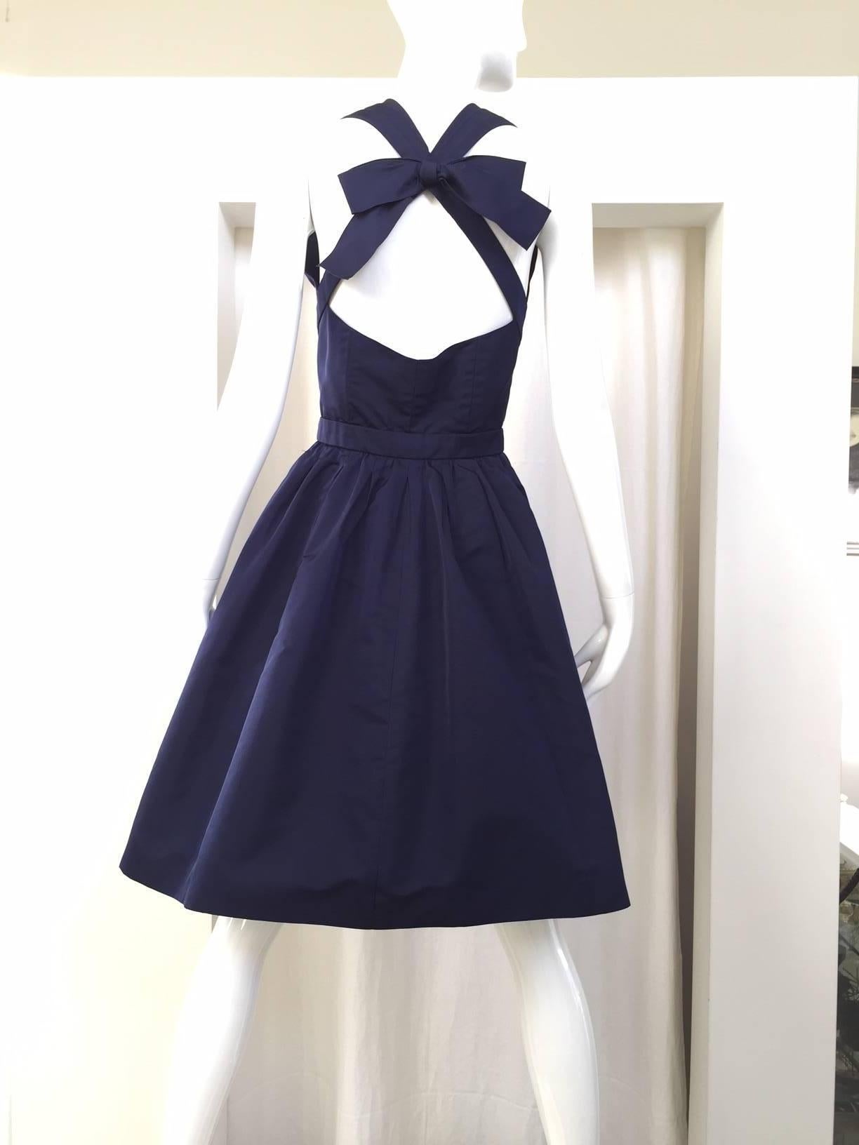 1980s CHANEL  blue cocktail silk dress with crisscross back with bow. 
Size: 2. Bust: 30"/ W: 24"/ Length: 38"
Fit: Small