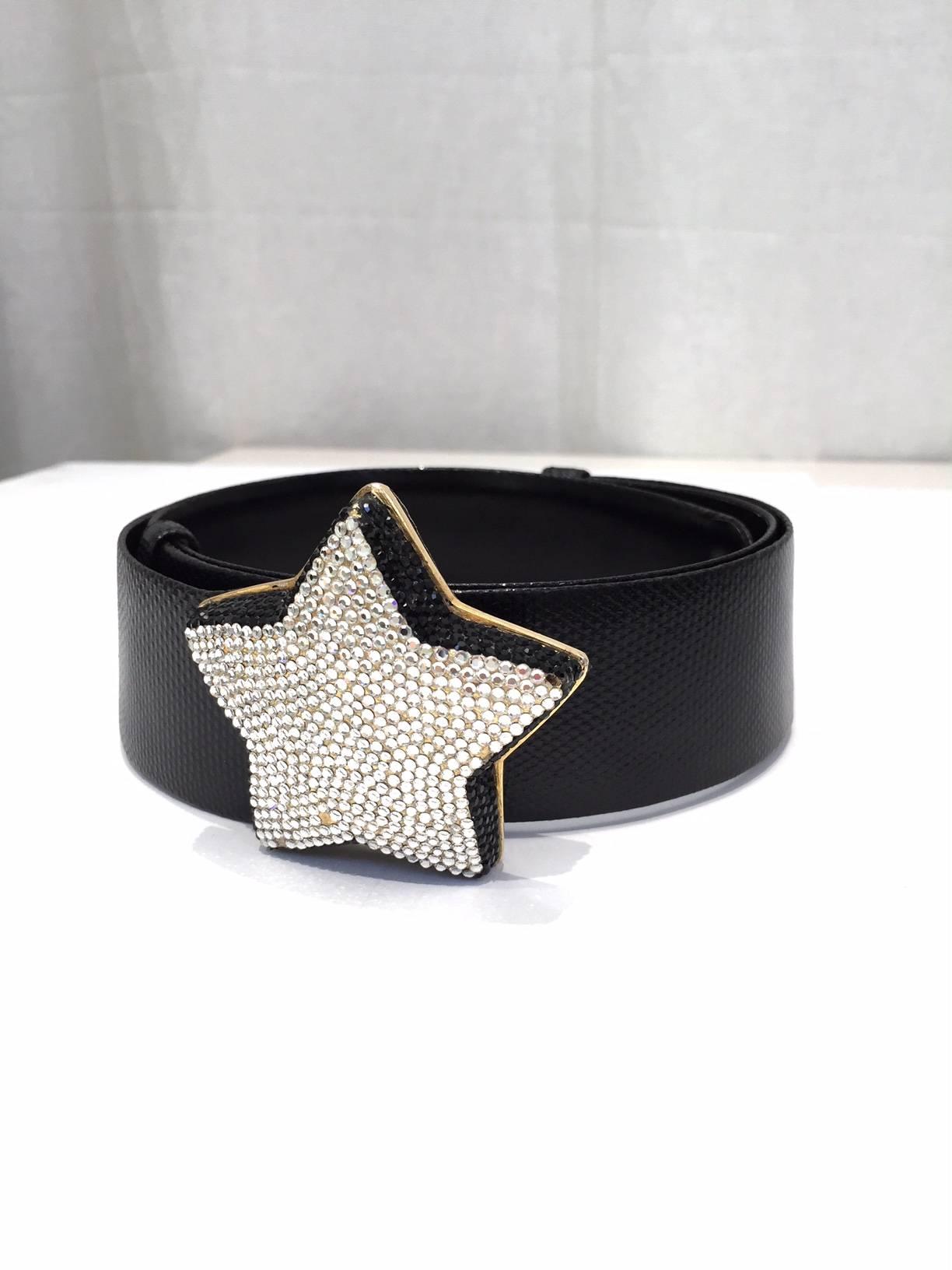Vintage Judith Leiber black leather belt with silver star jeweled buckled. Belt is adjustable.
fit size 2 to 8 SMALL - MEDIUM
This Judith lieber Belt is styled with vintage Yves saint Laurent black and yellow rose print floral wrap cocktail summer
