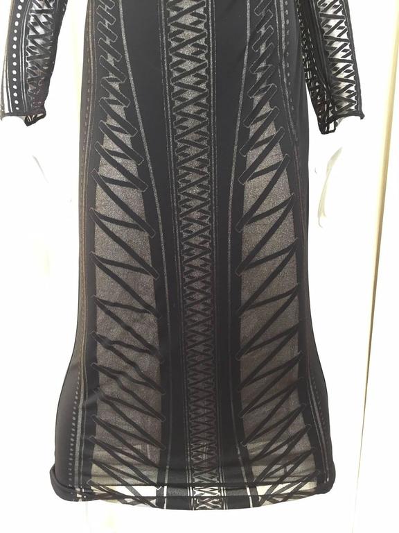 Vintage 1990s Gianfranco Ferre black knit dress with sheer sleeve. 
Size 6 / Medium
All Sales is final