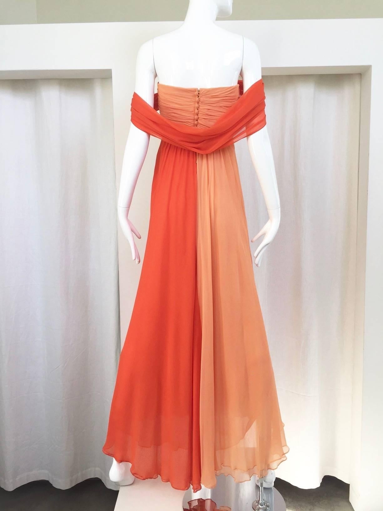 Beautiful vintage Bill Blass silk chiffon in Tangerine and light yellow strapless dress with shawl attached. Size: 6
Bust: 34”/ Waist: 30” 
Note: there is faint tiny water stains ( you can't barely see it) see pic attached.
This Gown has been