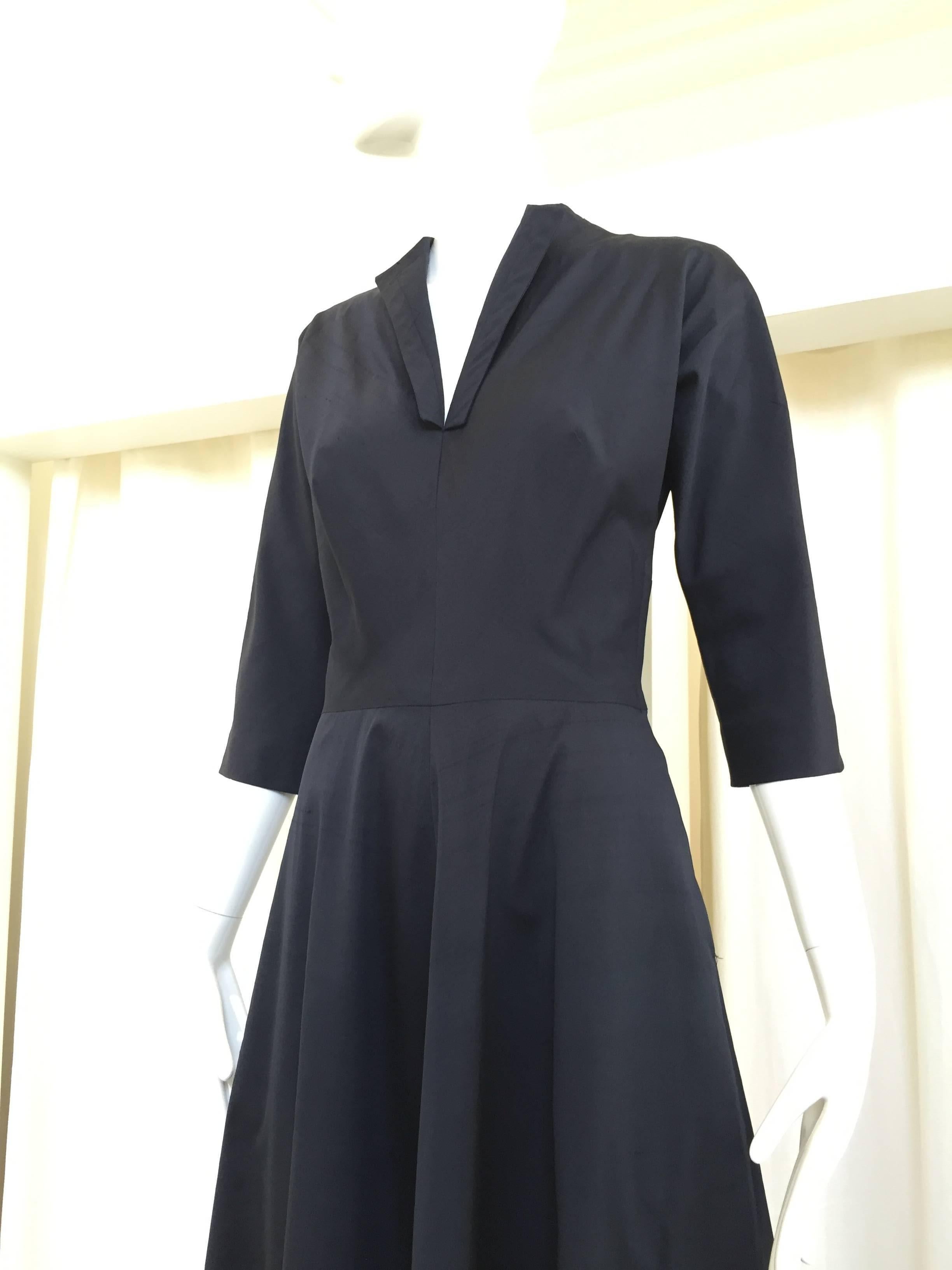 Timeless Claire Mccardell Black silk 1950s day dress. metal zipper on the side. 
Bust: 32