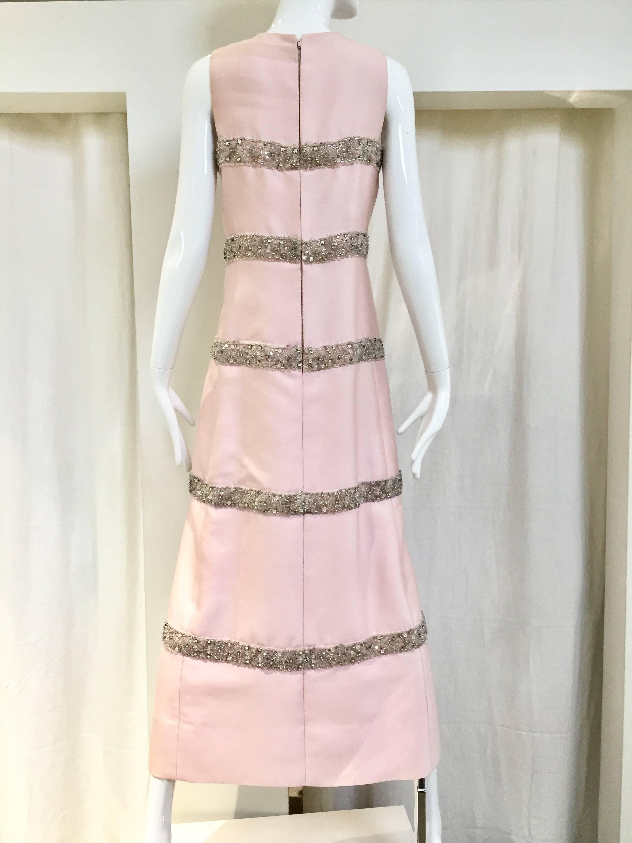 Beautiful Jackie Kennedy style Vintage 1960s pale pink silk shantung column gown with silver beads and rhinestones. Perfect for cocktail party. 
Fit Size: SMALL - Medium
Measurement: B: 33"/ W: 34"/ H: 38"/ Length: 52"

Note: