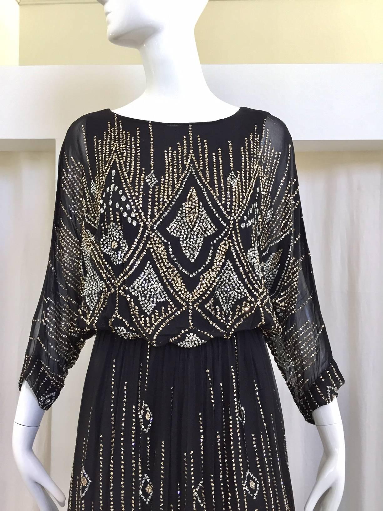 1970s Saks Fifth ave black silk metallic art deco print glitter dress. slip on dress ( no zipper)   Fit size 2/4/6 Medium
Shoulder : 16