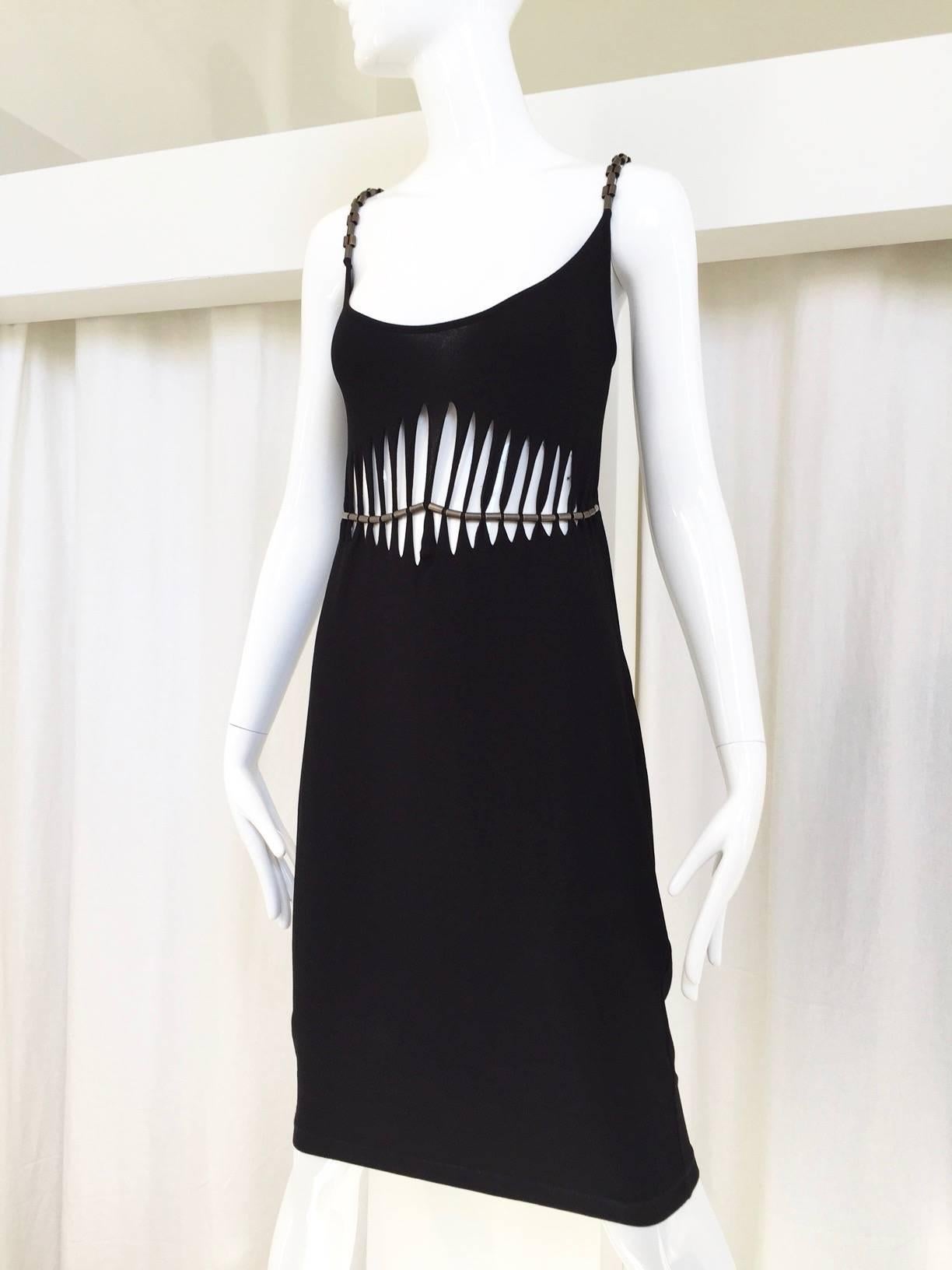 Sexy 90s Plein Sud black rayon cut out spaghetti strap body con dress with brass hardware.
Fit size 6/8 MEDIUM
Measurements ( not stretched) 
BUST :  35” (stretched comfortably)

