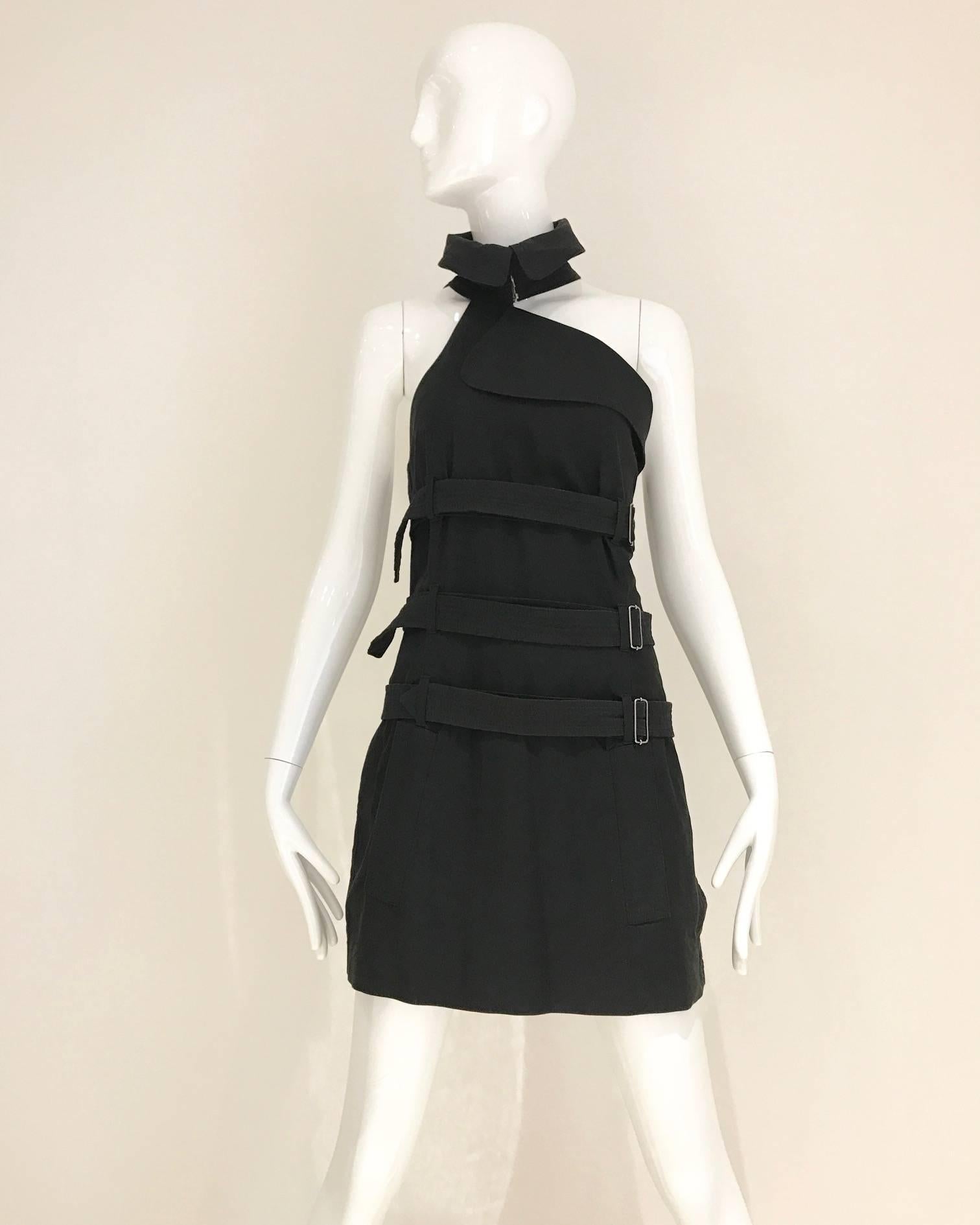 Sexy Vintage  Jean Paul Gaultier black cotton halter top/ or mini dress with straps 
(bondage style). 3 Belts wrap around and its adjustable. buttons on the side.
 Fit size: 6 MEDIUM
Bust: 36 inches/ Waist 33 inches/ Hip 36 inches/ Length: 32 inches