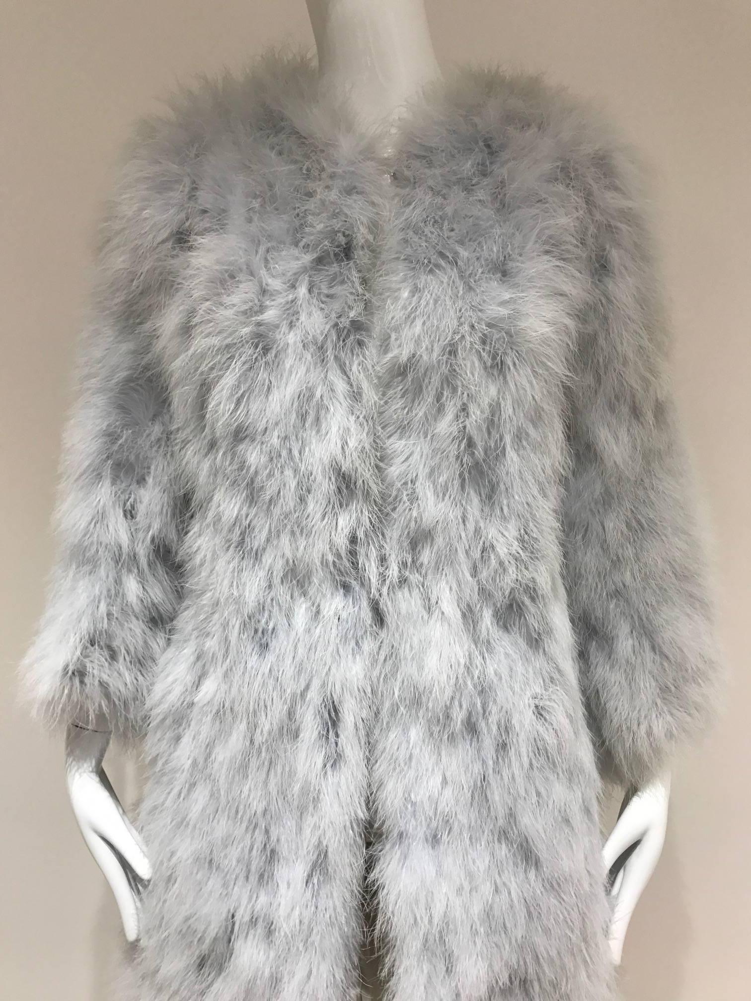 1970s Vicky Valerè light blue boa feather fluffy light coat. 
Fit size 4/6/8  Medium- Large  ( mannequin is size 2) 
Bust 40 inches/  coat length 43 inches/ shoulder : 17 inches/