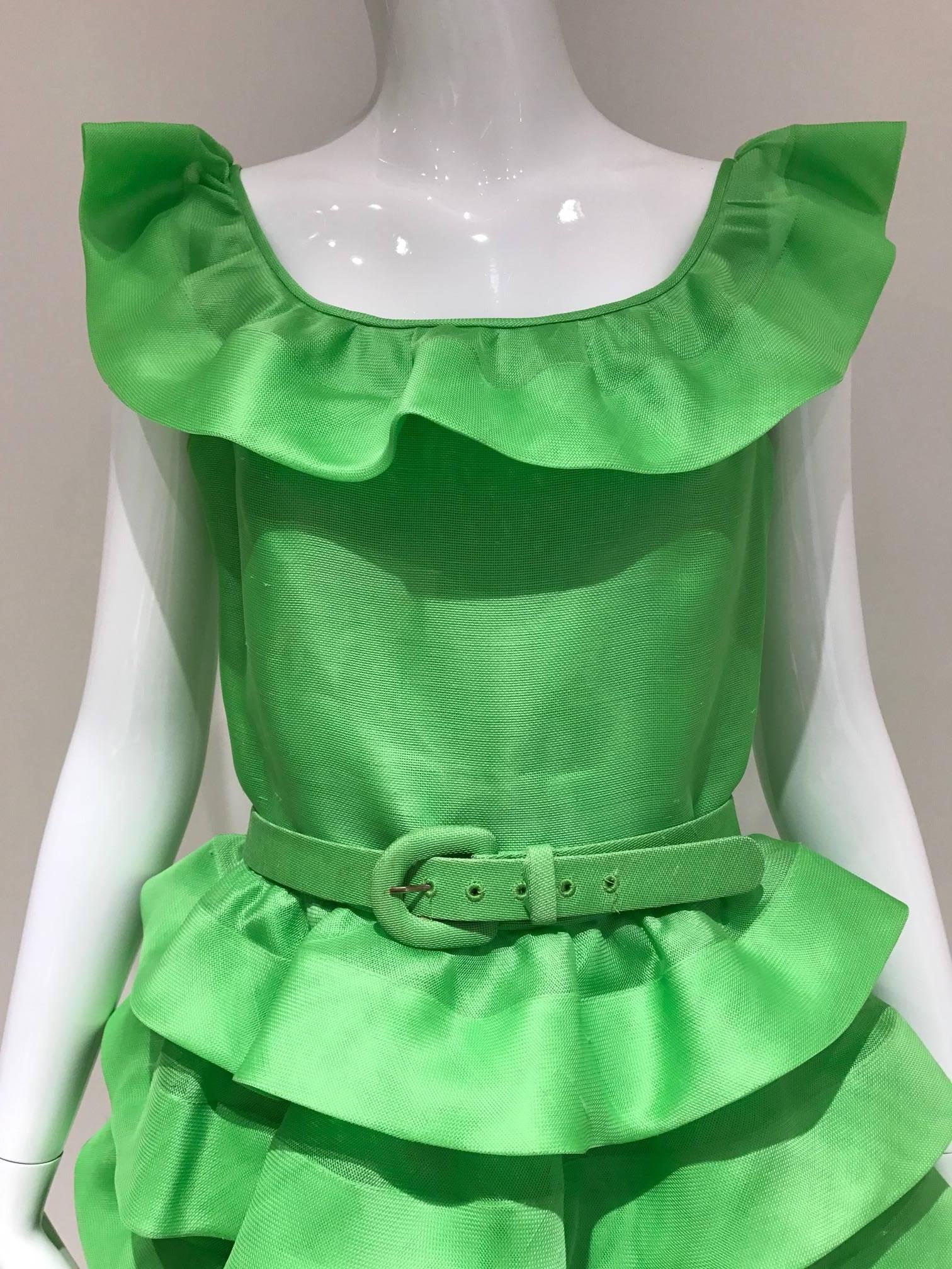What a fun party organza ruffle dress from Oscar De La Renta sold at Saks Fifth ave.  Due to the nature of the fabric, there are slightly ribbed on the fabric. it is not damaged.
Bust 34 inches/ Waist: 28 inches/ Hip: 40 inches/ Length: 38 inches