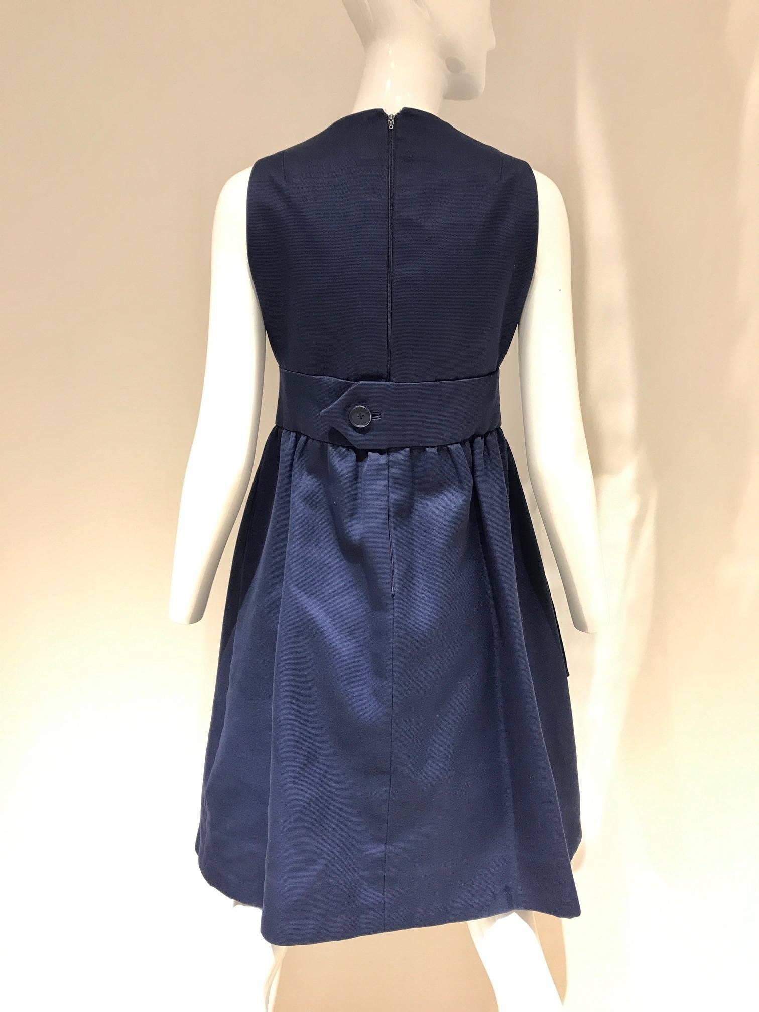 Vintage Geoffrey beene navy blue cotton cocktail dress, v neck,  large pocket and inverted pleat.
Bust: 35inches/ Waist: 28inches/ Length: 39inches