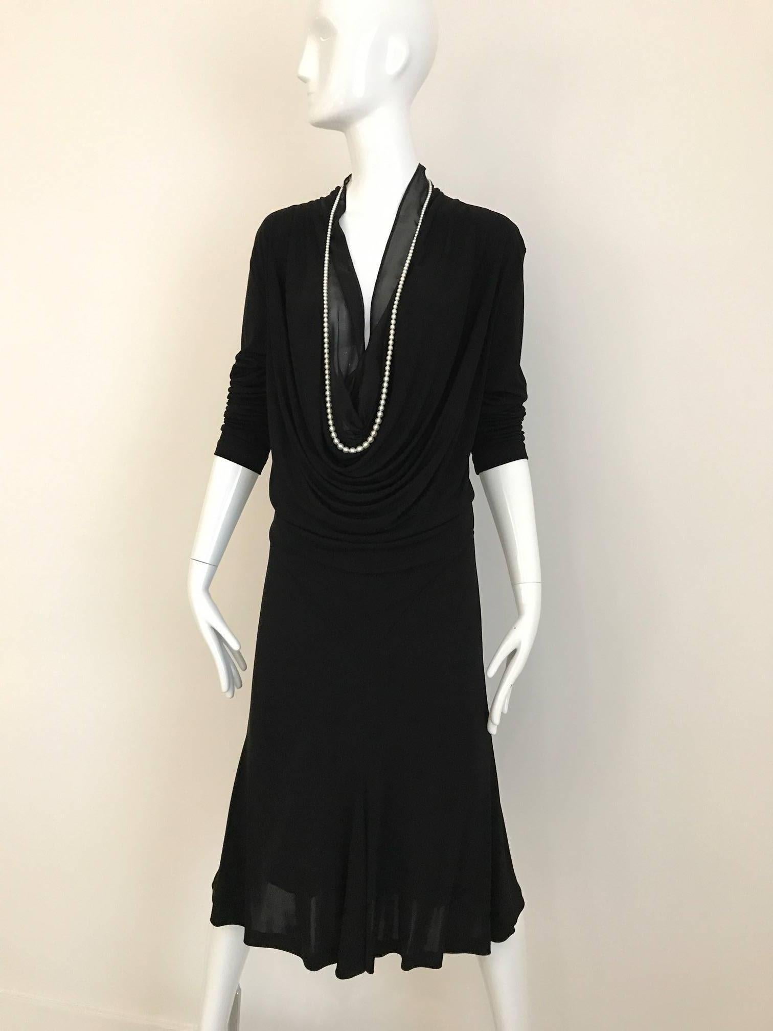 1990s Jean Paul Gaultier black jersey plunging neckline dress with pearl collar. Dress has sheer silk chiffon as a lining on the bust area (for modest coverage) 
Bust 42 ( blousy style) Waist: 32 inch/  Hip: 39 inch/  Dress Length: 45 inch
Fit