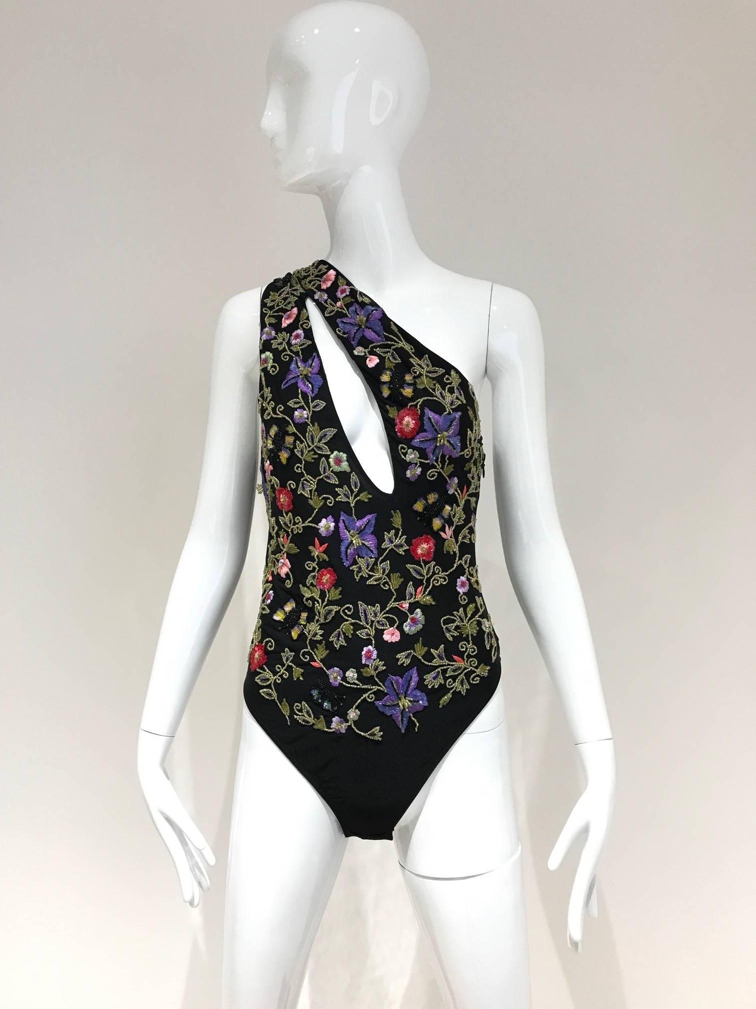 Beautiful Armani black mesh beaded with sequins and beads cut out body suit or swim suit. Multi color beads floral and butterfly in red, purple, green, purple and pink color. Sexy body suit or bathing suit. 
Fit size 2/4/6 . Brand New with tag.