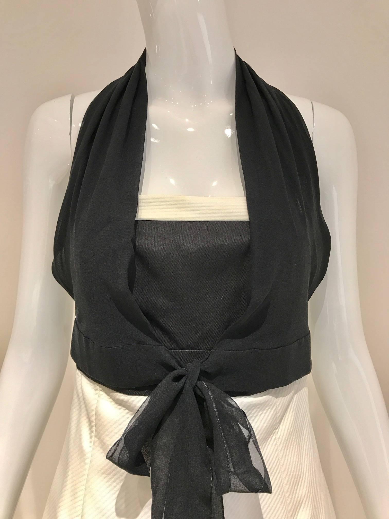 1990s Chanel strapless white cotton dress with detachable black silk chiffon halter top. 
Dress can be worn as strapless dress or wear it with black silk chiffon halter top. Perfect summer cocktail dress.
Size : 2/4 Small
Bust :31” / Waist 26”/ Hip