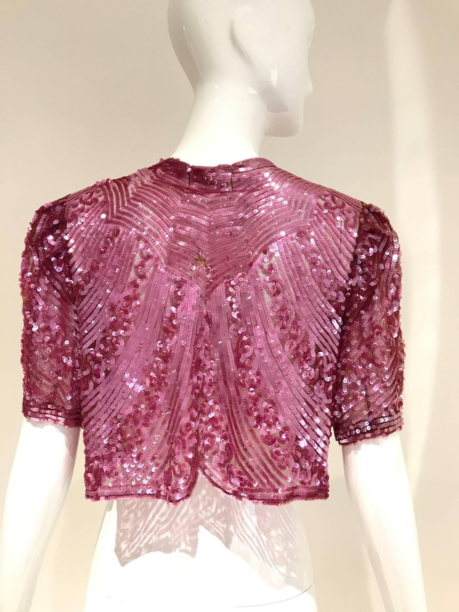 1930s incredible raspberry pink sequin cropped bolero jacket. Made in France.
Fit size 2/4