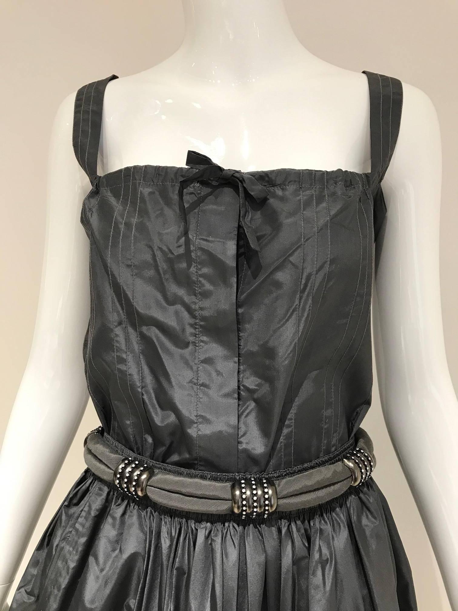 Beautiful 3 pcs vintage  Laura Biagiotti silk taffetta pewter tank top, skirt and belt set.
Top fit size 6 / Bust: 36 inches.
Skirt is elastic stretch to 30 inches/ Skirt Length: 35 inches