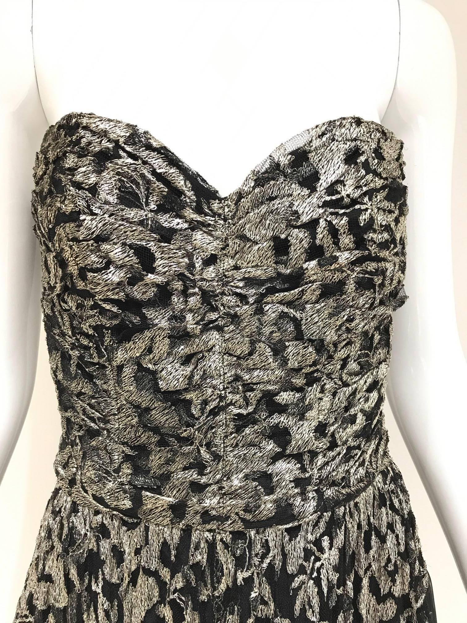 1930s strapless silver lame embroidered strapless cocktail dress.
Size 4