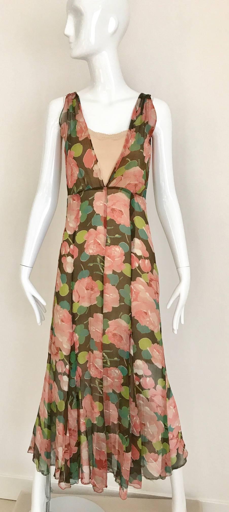 1930s silk floral print in peach,chartreuse green and teal Silk day dress. This dress can be worn both way see image#4
Image#2 dress is worn with slip. 
Best fit size 2/4. Shoulder should be no more than 15 inch
Bust: 34 inches/ Waist: 28 inches/