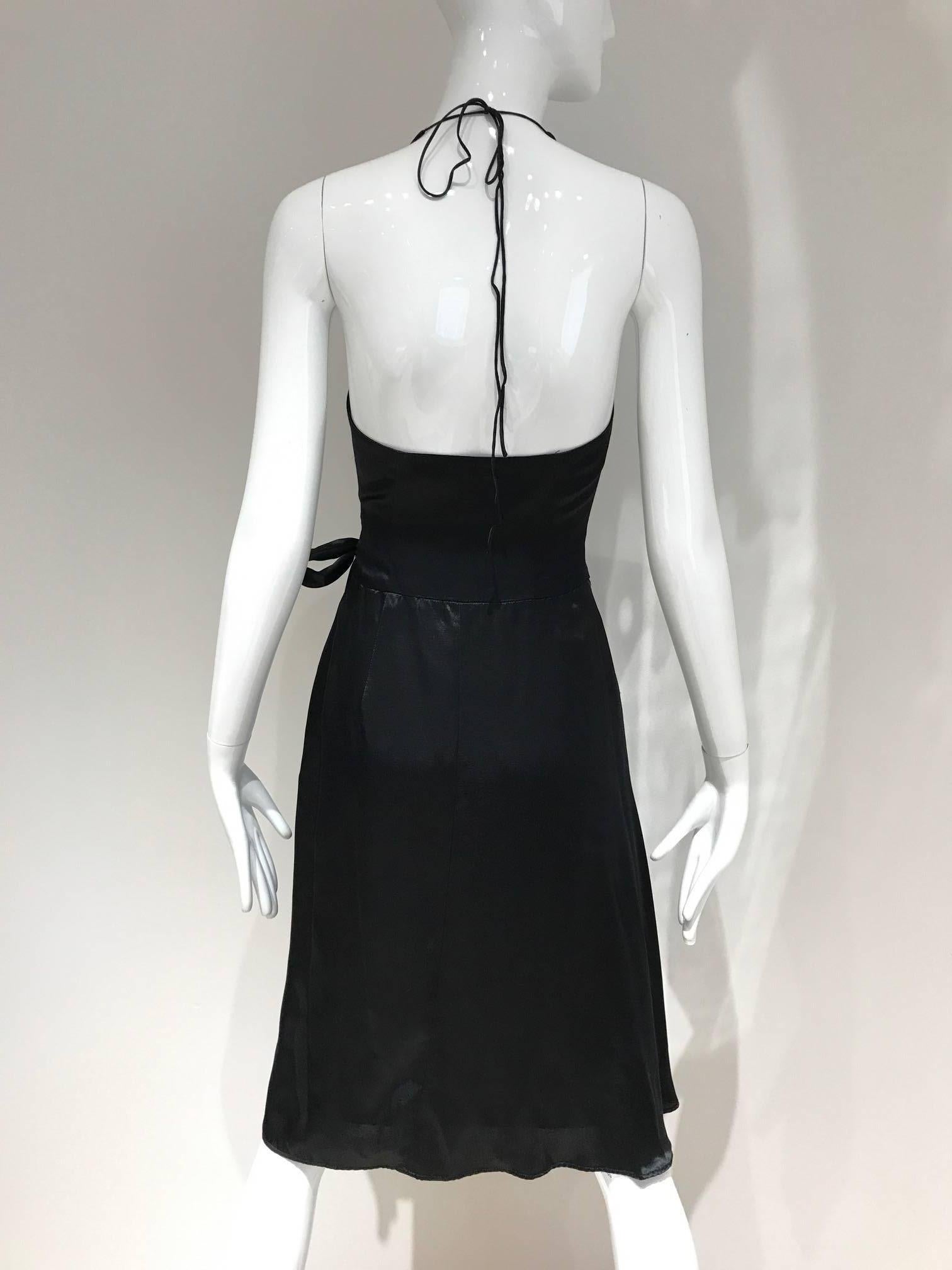 Sexy Vintage Vivienne Westwood wrap halter dress. 
Size: 2/4. Small
Bust: 32 inch / Waist: 26 inch
**** This Garment has been professionally Dry Cleaned and Ready to wear.

