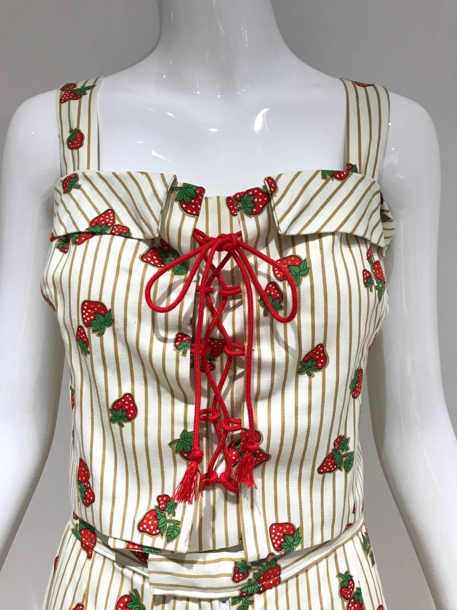 What a fun summer picnic cotton crop top and pants ensemble! 1970s cotton crop top spaghetti strap bustier style top.  Top can be adjusted to 34inches . Made of nice thick cotton in strawberry print.  Pants is cut straight with a little bit flair to