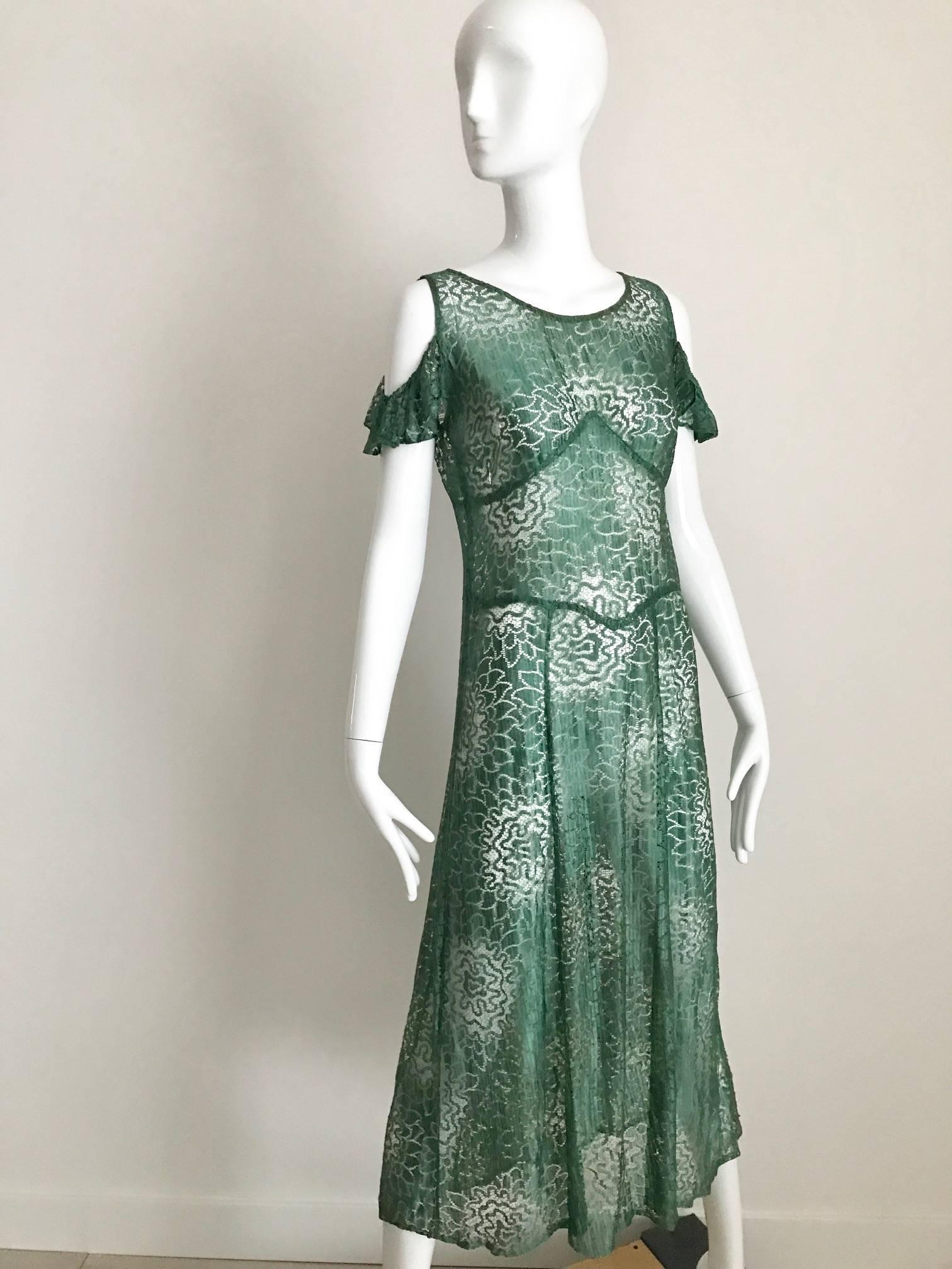 Beautiful 1930s Green lace cut out define floral pattern. 
Size: Small . Best fit US size  2 or XS
Bust: 32 inch  / Waist 29 inch /  Hip: 38 inch / Dress Length: 48 inch
