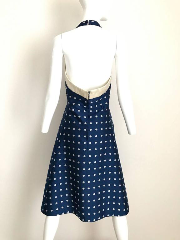 Timeless and chic vintage 1950s Werle blue and gray polkadot summer cocktail halter a line dress with pockets. Perfect summer cocktail dress. Audrey Hepburn style.
Bust: 34" / Waist: 28"/ Hip: 42 / dress is not lined