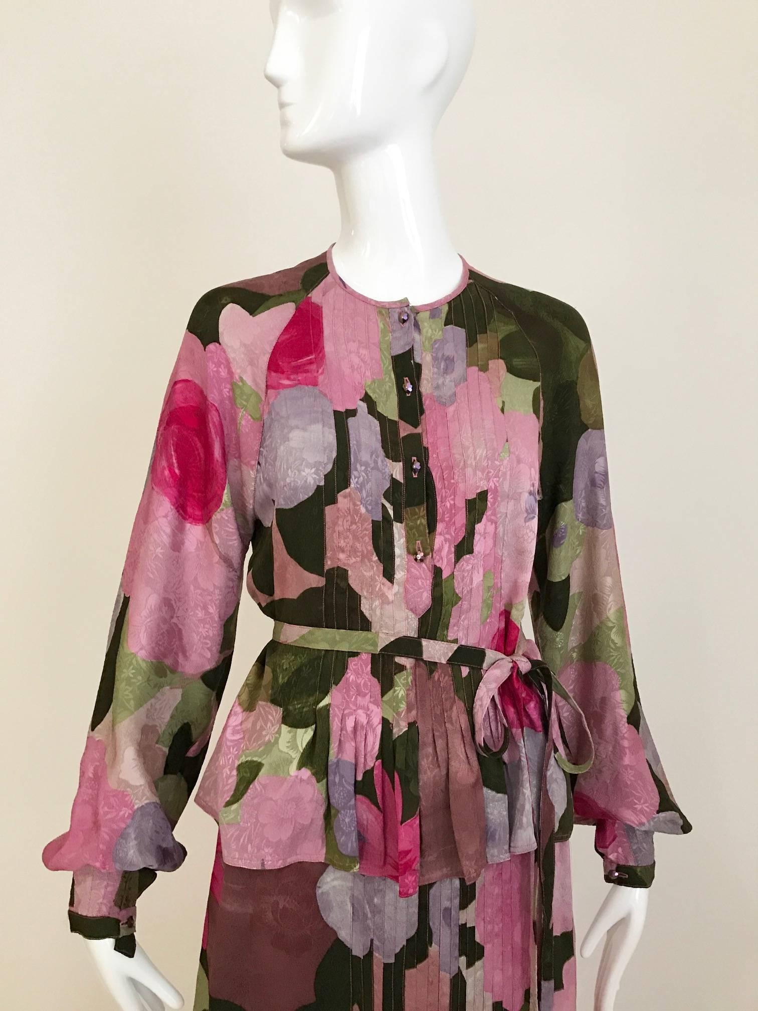 This 1970s Geoffrey Beene floral print mixes pink, fuchsia, lavender, grey and black on beautiful silk jacquard fabric.  The bohemian, 2pcs, blouse & skirt set has pintuck stitching running vertically down the front on the blouse and skirt. And the