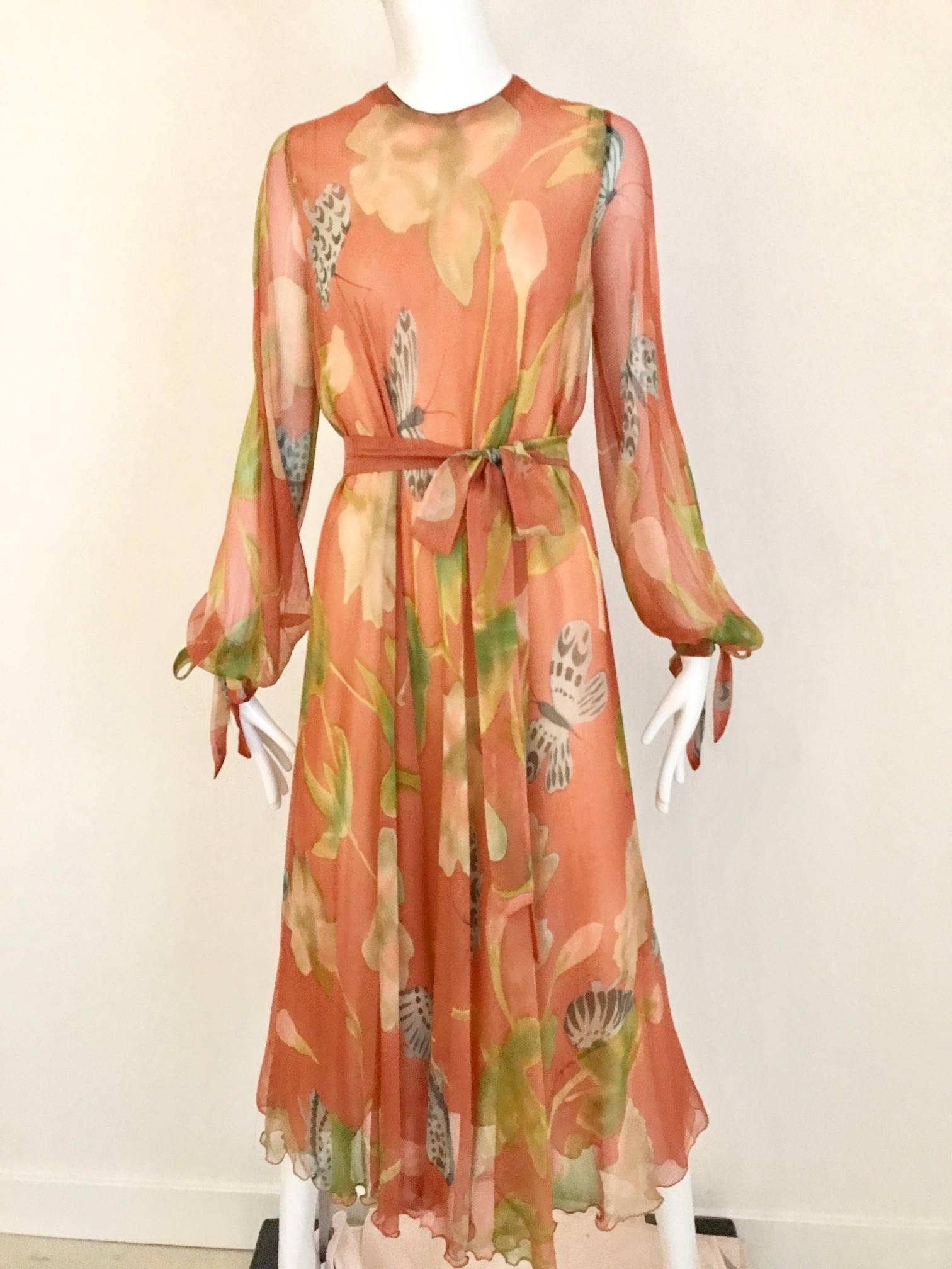 This 1970s Anna Weatherly bohemian beauty is silk chiffon with long sleeves with long sash ties. It has a detachable ruffle collar that can be used to create excitement around the neck. Anna Weatherly is known for her elaborate botanical hand