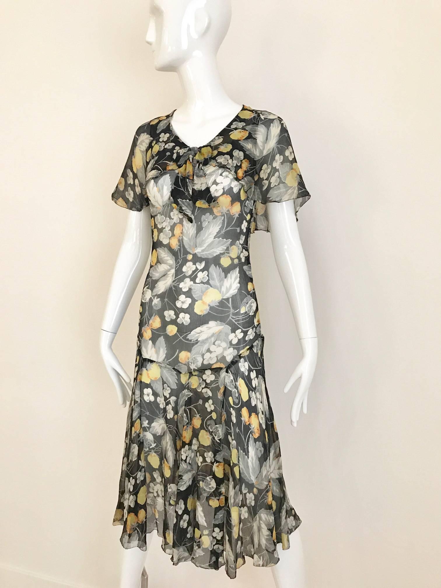 Beautiful vintage floral print in yellow, grey, and white . small bow on the neck line, flutter sleeves and slip on dress. Dress has no snap or zipper. 
Size: XSmall or small for petite 
Bust 32 inch / Waist: 24 inch  / Hip 33 inch / Dress length: