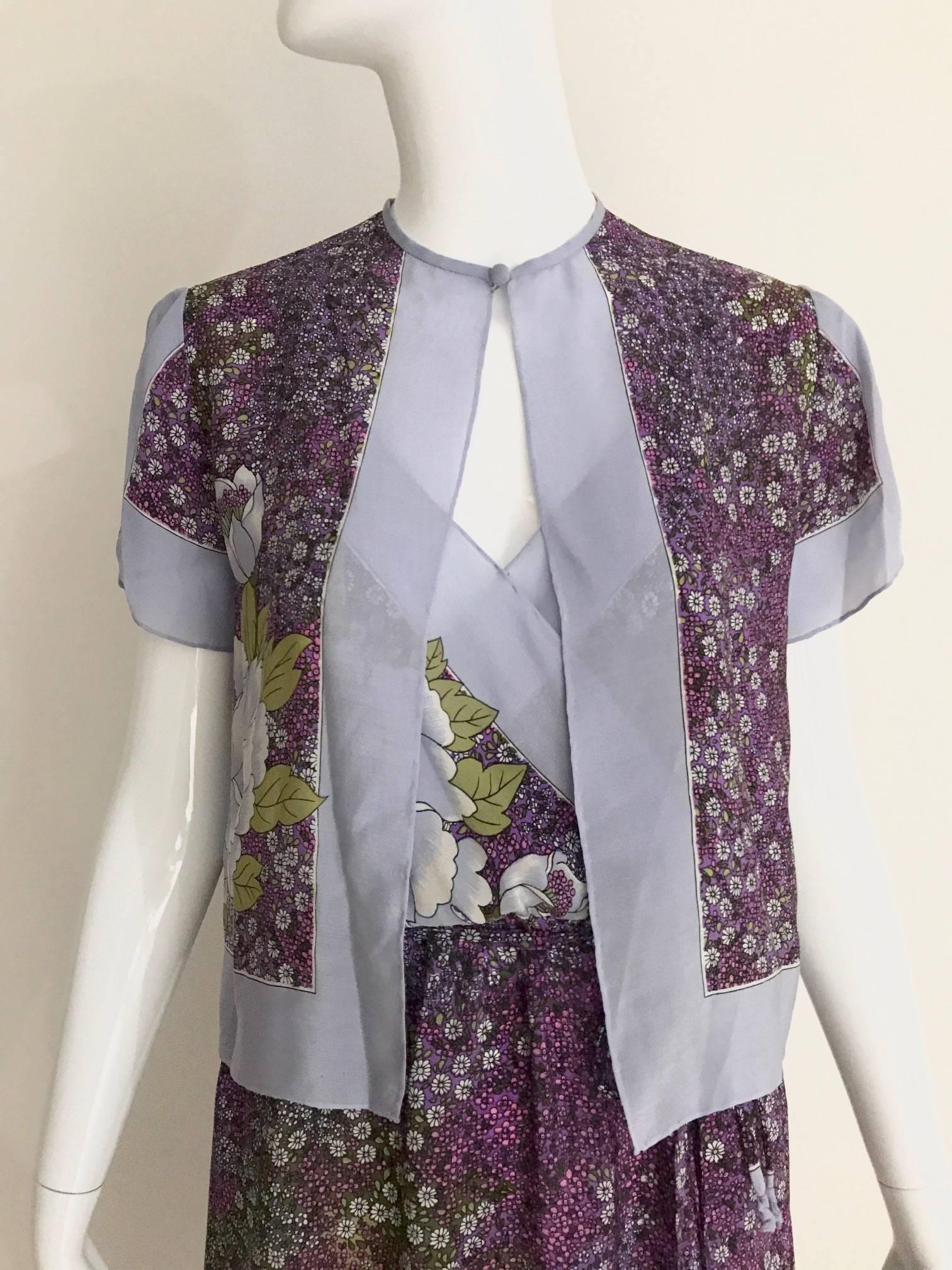 Vintage 1970s 2 pcs ensemble Silk Dress and Cropped jacket in purple and gray floral print spaghetti strap  summer dress ensemble. Dress has elastic waist band and V neck bust. 
Size: 2/4/6 Small - Medium
Bust: 34 inch   / Waist: 24 inch stretches