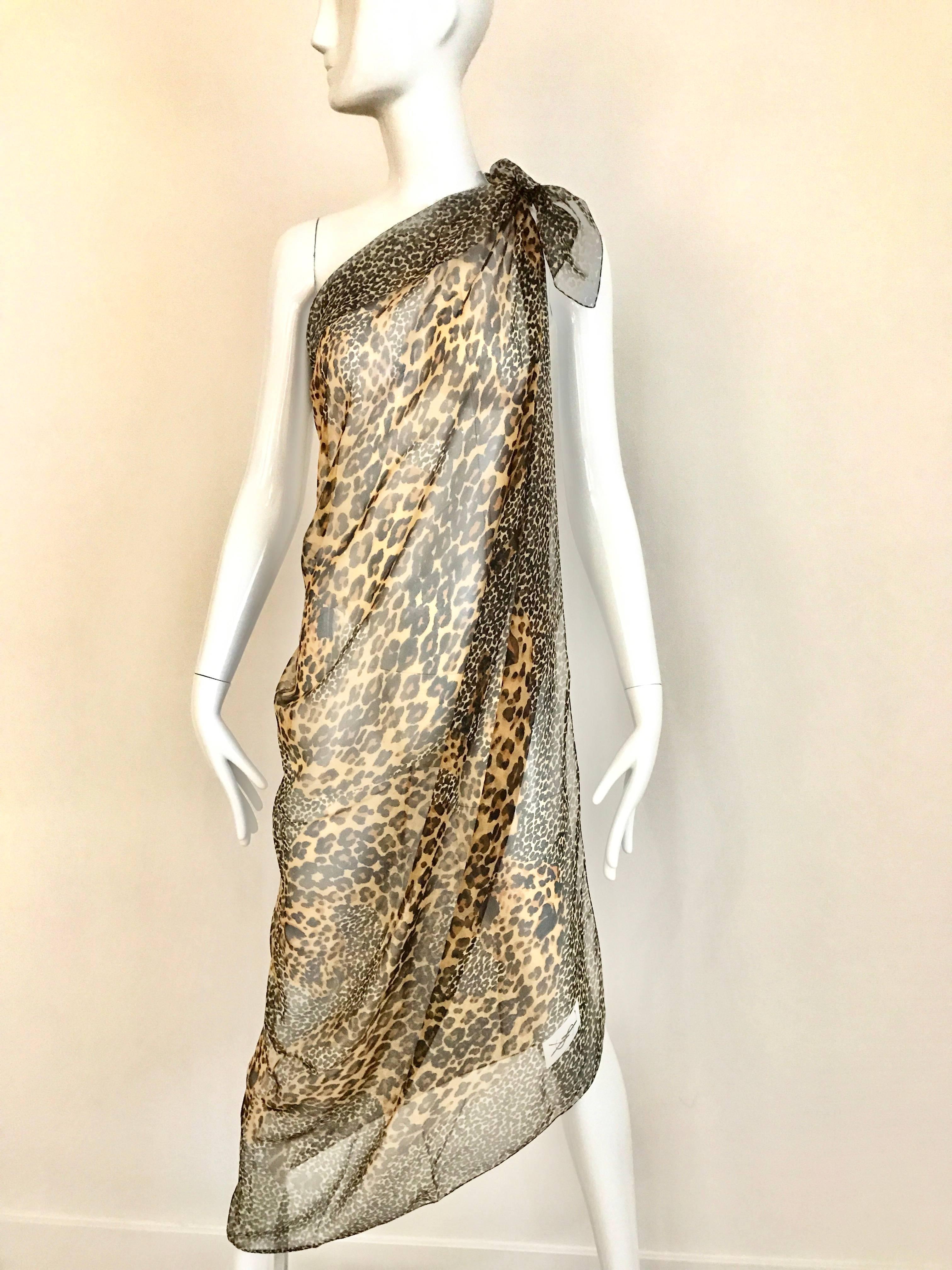 Vintage Late 1980s early 1990s Yves Saint Laurent brown and black silk leopard print oversized large scarf / shawl/ Halter top or beach cover up.
Scarf in excellent condition
54 inch x 54 inch