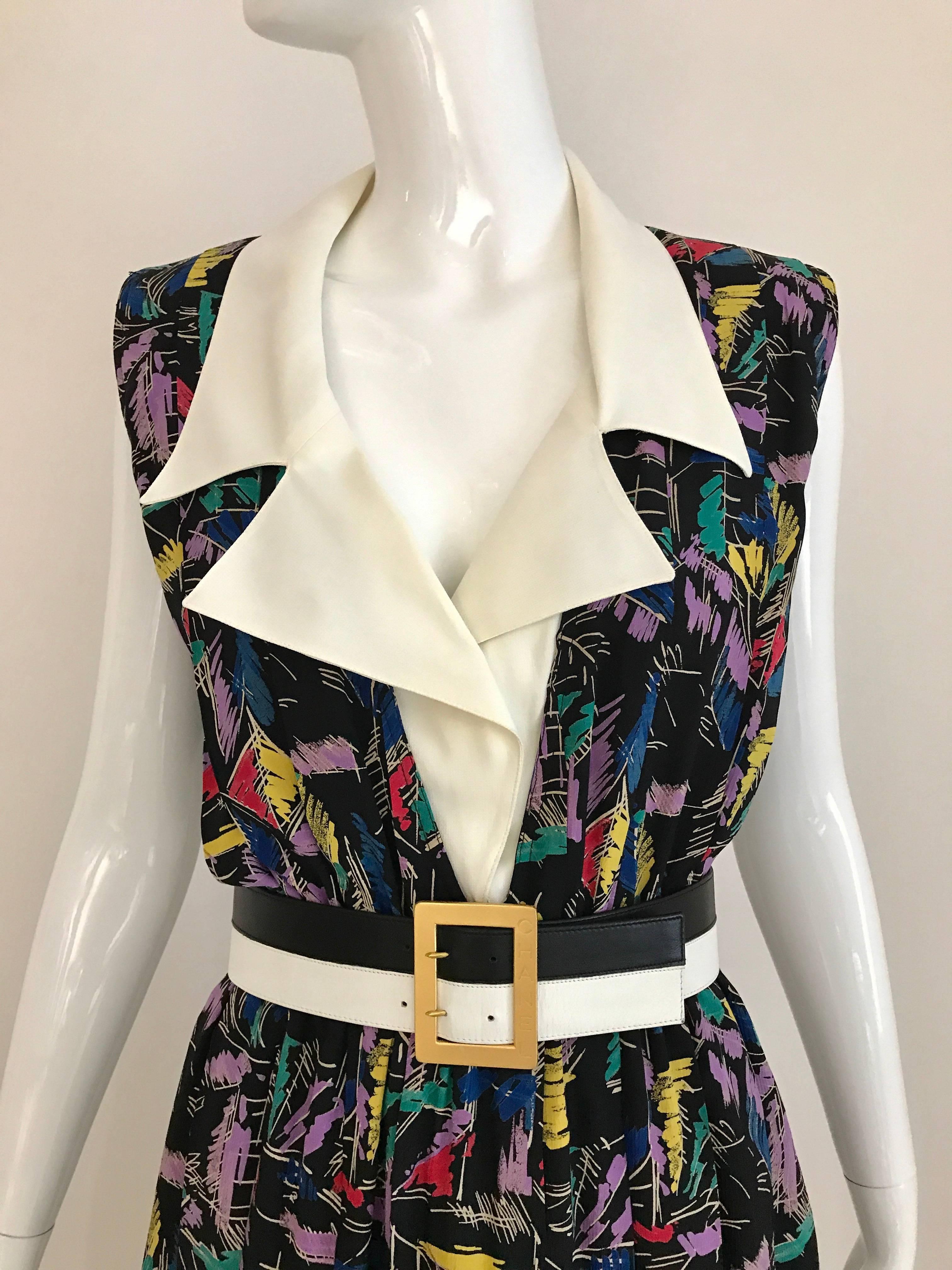 Vintage 1980s CHANEL by Karl Lagerfeld  two tone black and white leather belt with gold square buckle.
Fit Size: 2/4
Waist: 26 inch
Belt is styled with Vintage Chloe Abstract Print Summer dress available for purchase at Sielian's Vintage Apparel