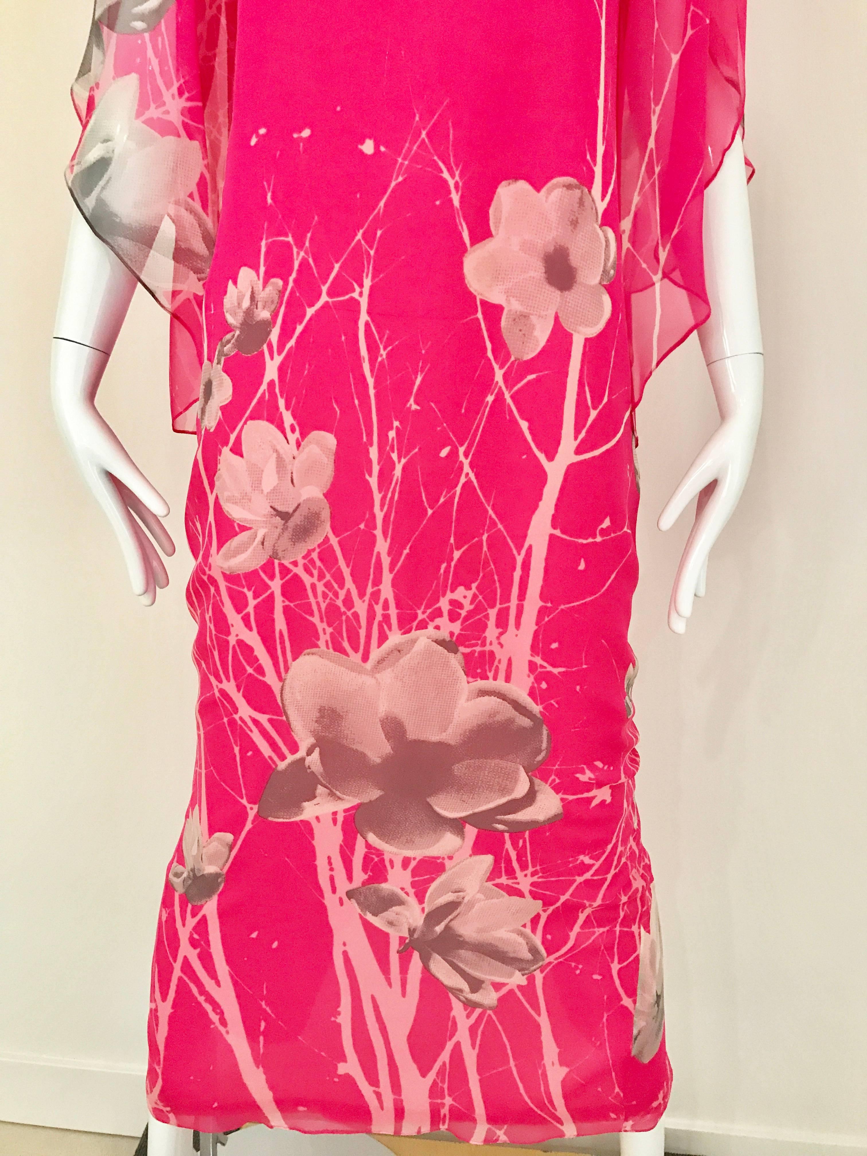 Vintage 1970s Hanae Mori bright hot pink and grey floral print Caftan style maxi dress. 
Dress has  3/4 sleeves and button at the back.  
Measurement:
Bust: 36 inch  / Waist: 34 inch  / Hip: 37 / Dress Length is 54 inch
Fit Modern Size : 4/6  Small