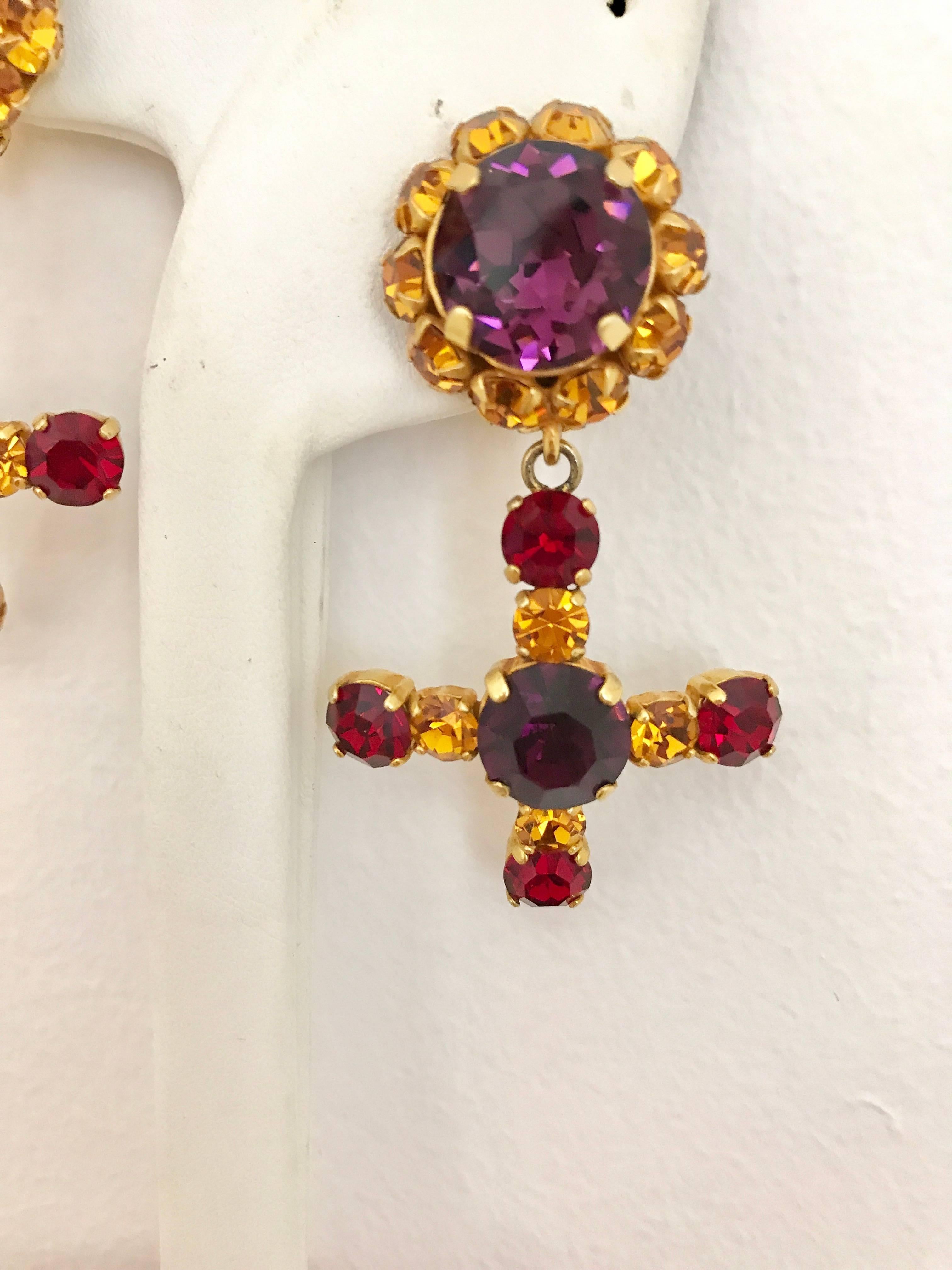 Vintage 1980s Dominique Aurientis Purple, red and amber Cross  rhinestones Clip on earring. Earring in excellent condition.