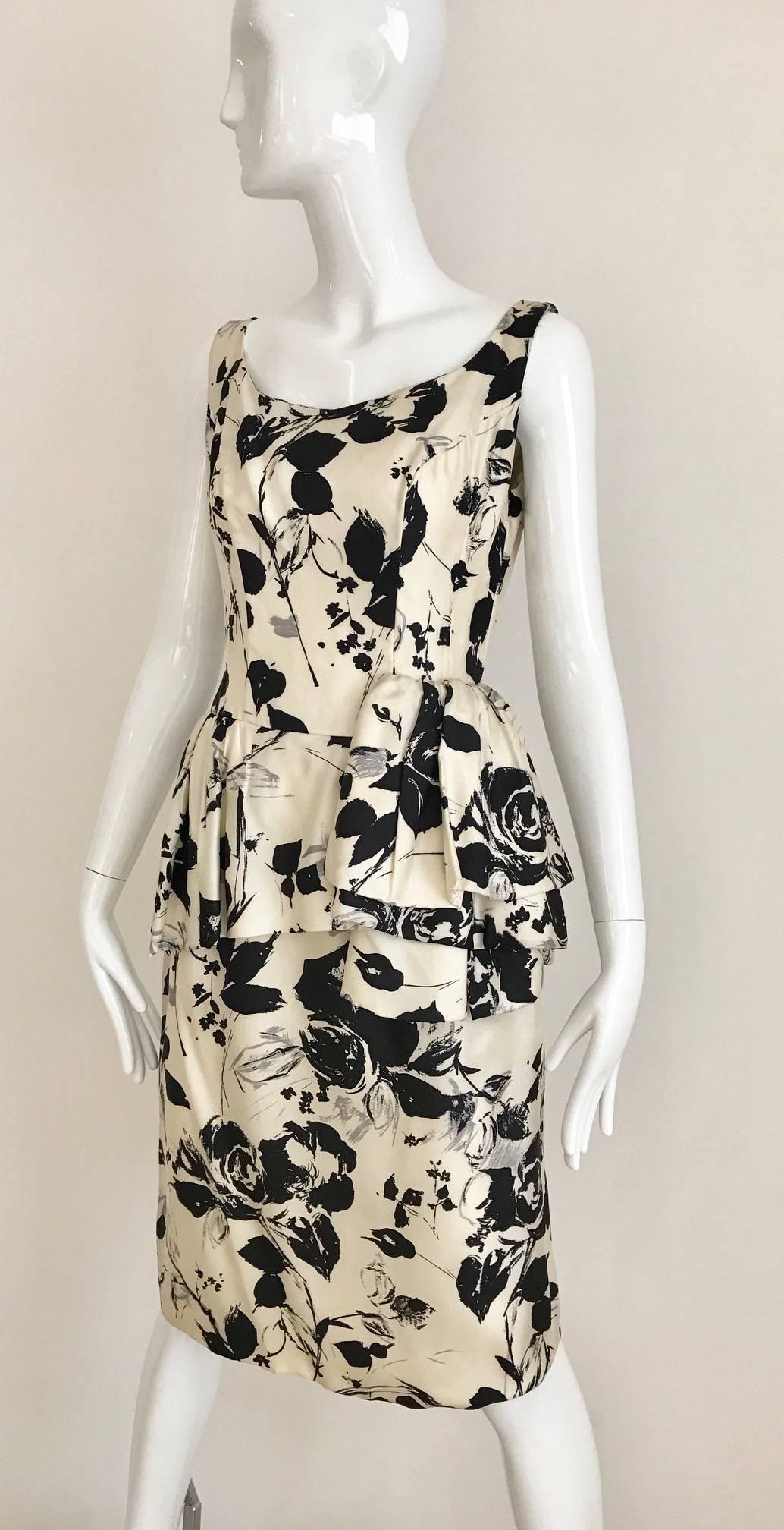 Chic 1960s Black, White and grey floral print silk sheath wiggle  Vintage 60s cocktail  Dress. Slightly peplum below the waist. Original metal zipper from 1950s and late 60s. dress is fully lined. 
Fit US 4 or 6  - Small - Medium