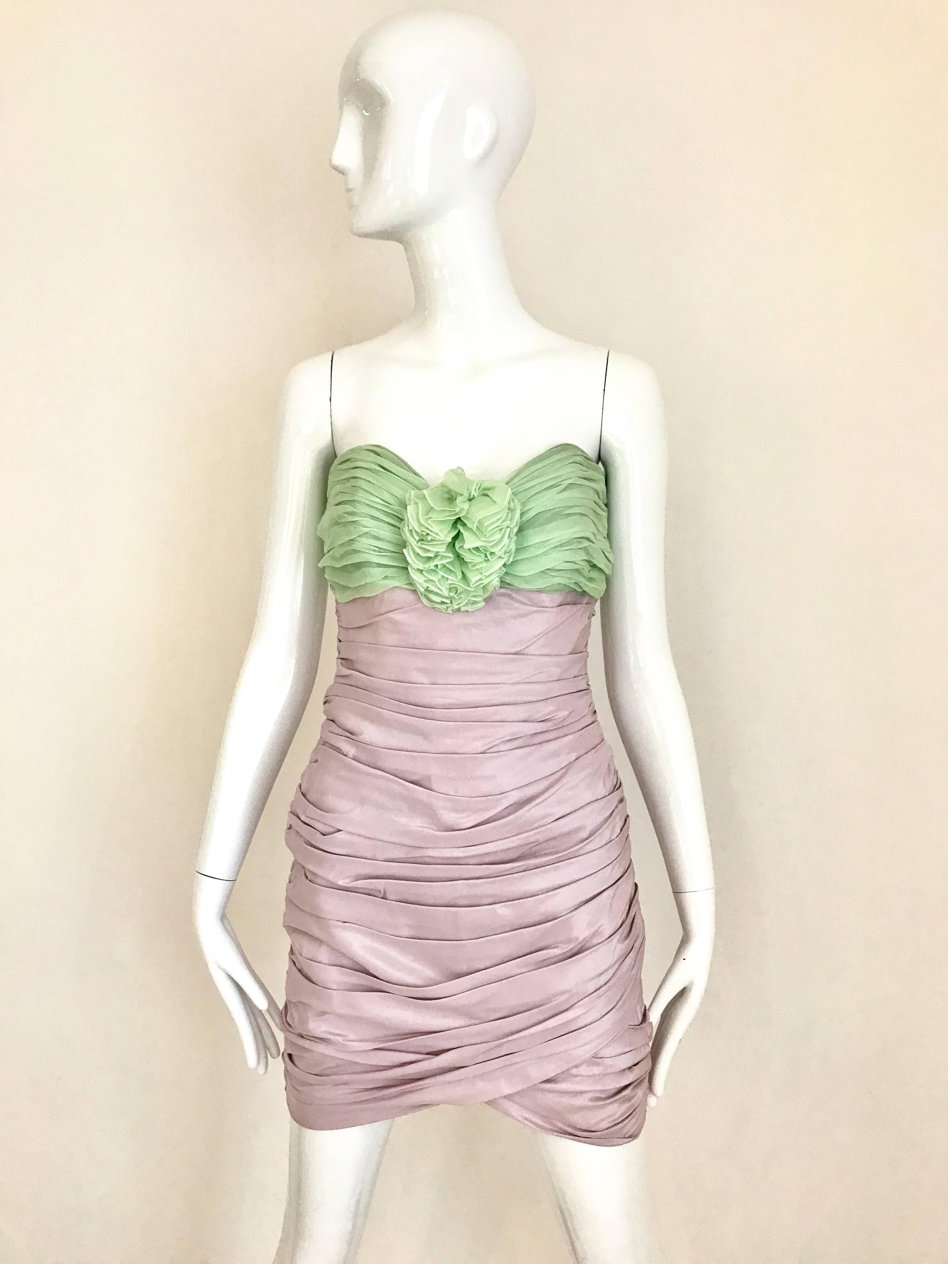 Sexy and Fun 1980s ANGELO TARLAZZI  silk Strapless two tone Lilac and light Green mini cocktail dress. Beautiful flower silk corsage on the bodice. Invisible side zipper.  
Size: 4 
Bust: 34 inches / Waist: 28 inch/  Hip: 34 inch/ Front Length: 22.5