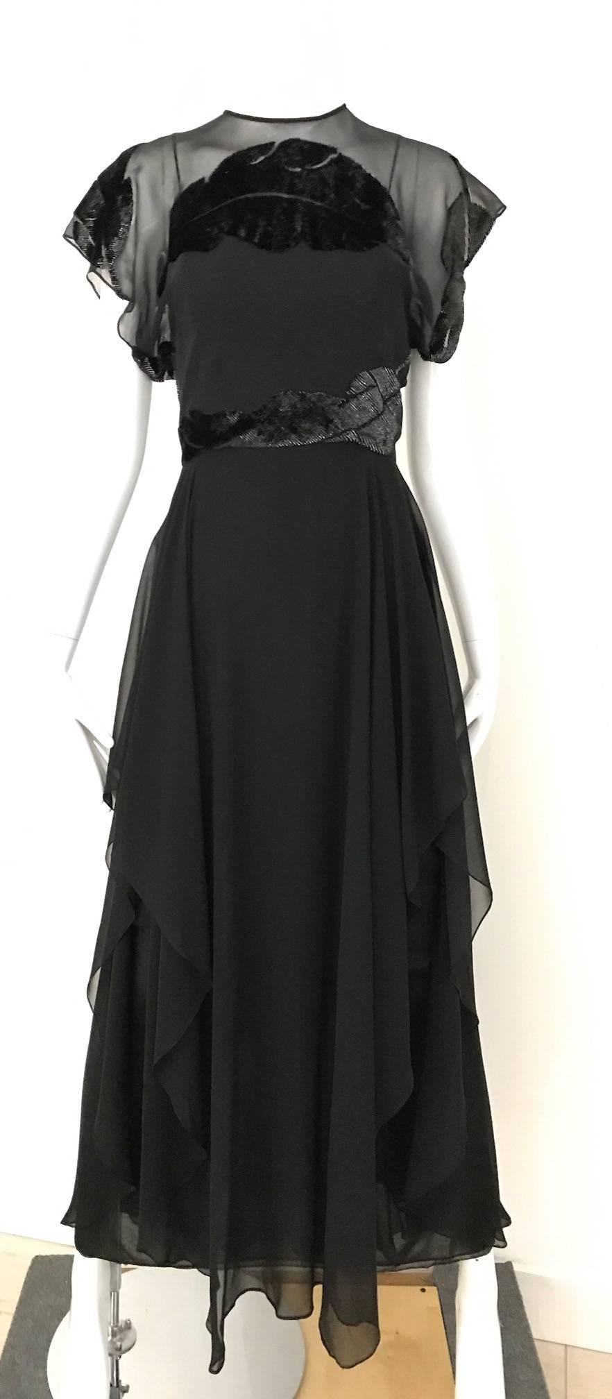 Beautiful Vintage 1970s Neiman Marcus Black Silk Chiffon Dress with overlay velvet cut out leaves  pattern on the bodice and the back. There are three layer of silk chiffon.
Size: 2/4 Small
Bust: 34 inch/ Waist: 26 inch/ Hip : Open/ Dress Length :