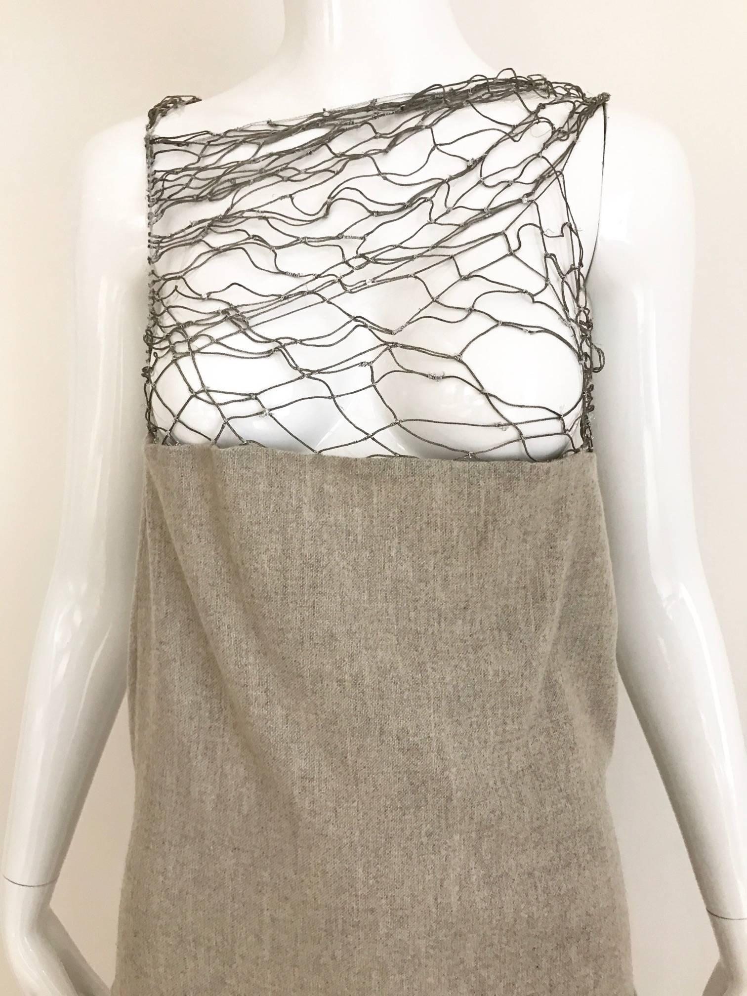 Beautiful Soft Gray Cashmere wool Dress from Narciso Rodriquez. Lattice silver metallic thread on the bust. Slightly A line skirt. 
This dress marked size 12 but it fit size 6 or 8 Medium ( see measurement)
Bust: 36 inch
Waist: 30 inch
Hip: 36 inch