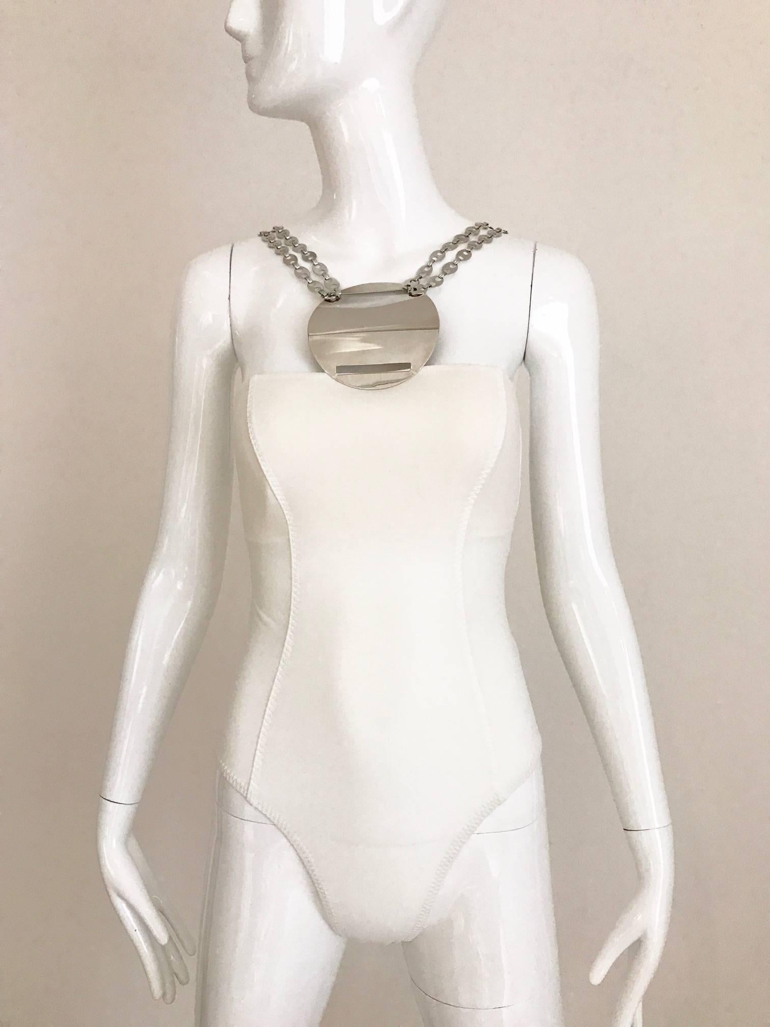 Vintage Paco Rabanne 90s White Bathing Suit with metal plate and chain link.
Bathing suit can be worn as body suit with skirt or pants. This bathing suit has thin padded bra . Bathing suit is dead stock ( never worn)  This paco rabanne bathing suit