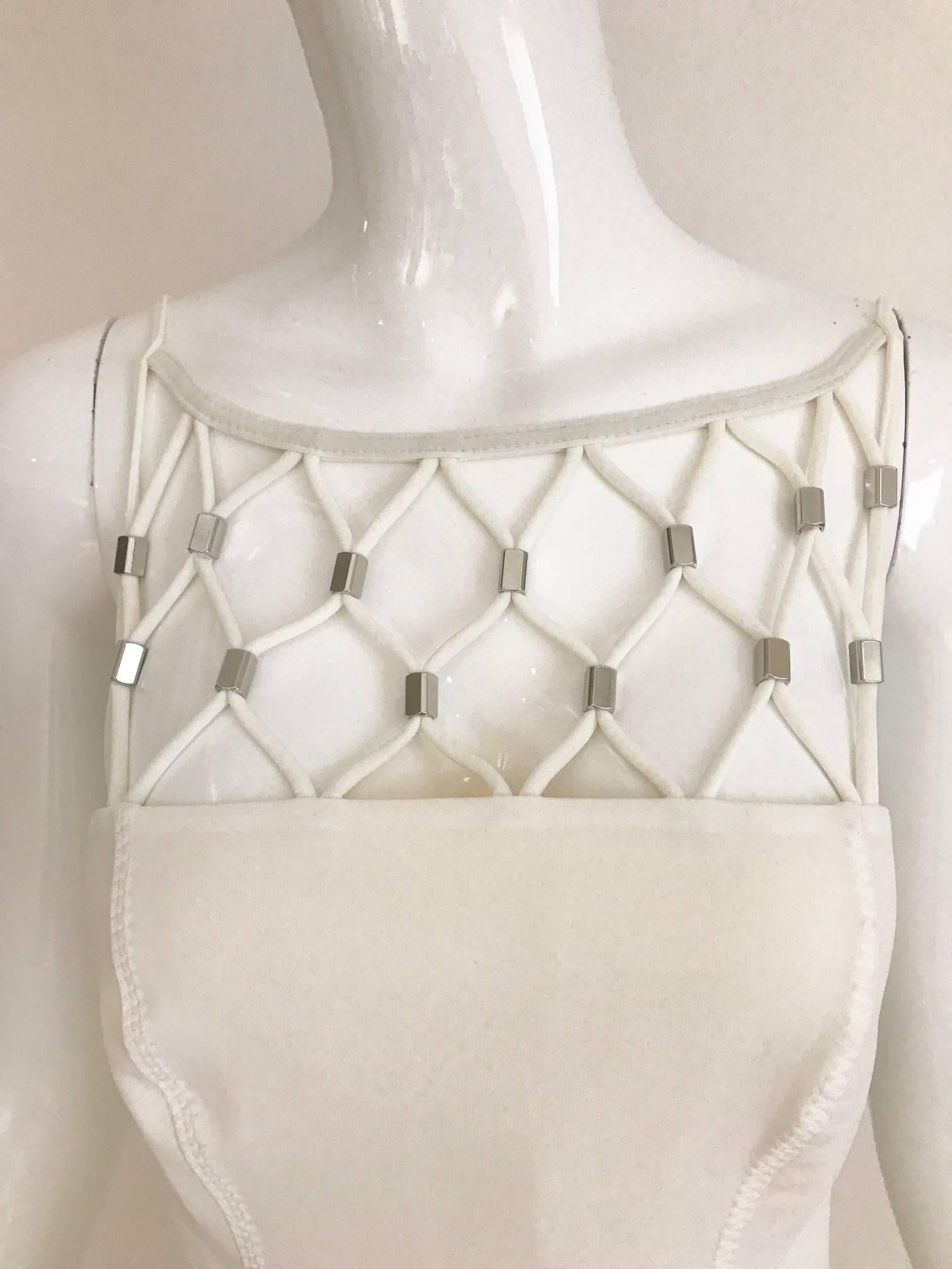 Never Worn Paco Rabanne White Lattice One Piece Bathing Suit. Bathing suit still has store tag.
Marked Size 40.  Fit size 4/6
Bust: 32 inch - 34 inch
Waist: 28 inch - 30 inch
Hip: 34 inch - 36 inch

