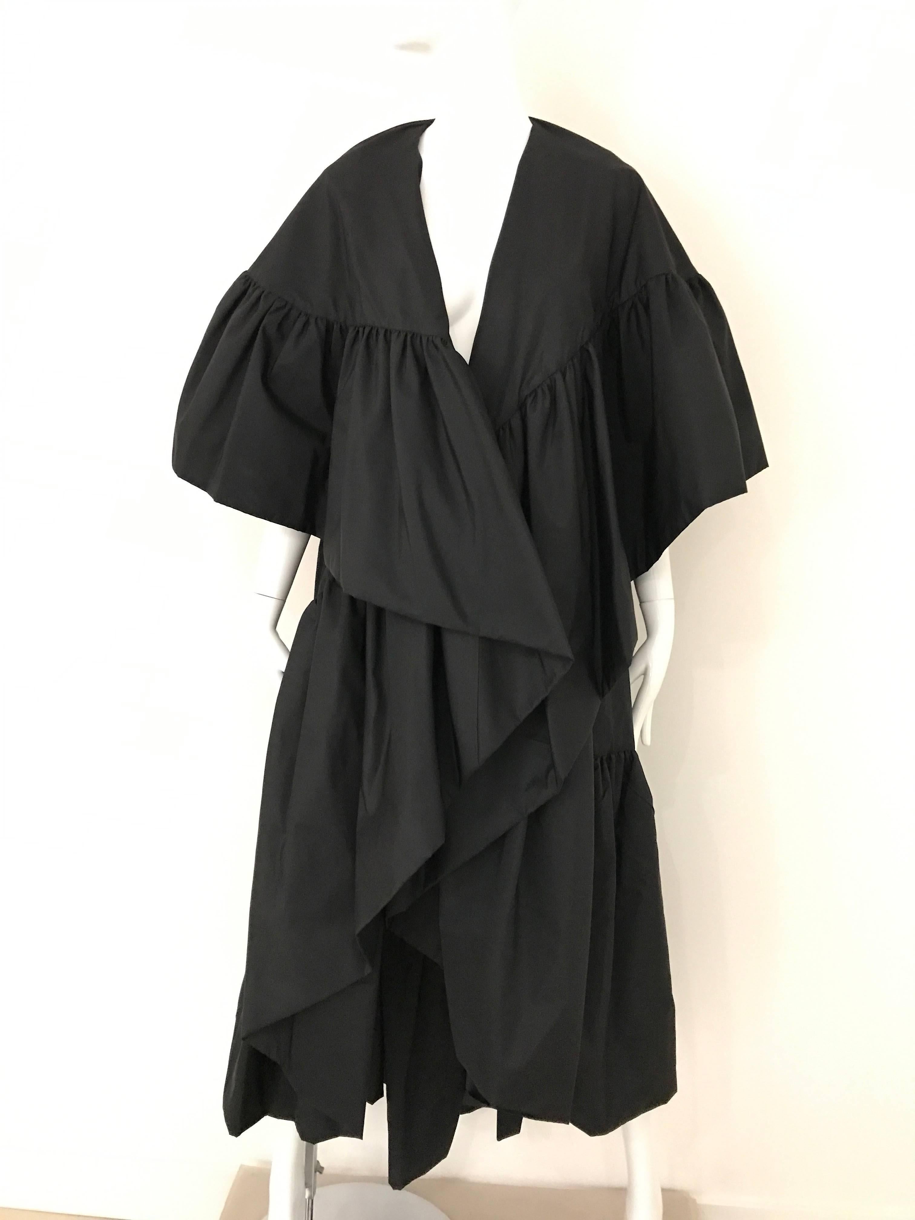 Dramatic Vintage 80s Richilene Silk Taffeta Ruffle evening opera cape coat. 
Cape/ coat has no fastener. Styled with Judith Leiber belt available for purchase at sielian's vintage 1stdibs store. 
Fit SMALL - MEDIUM 4/6/8

**** This Garment has been